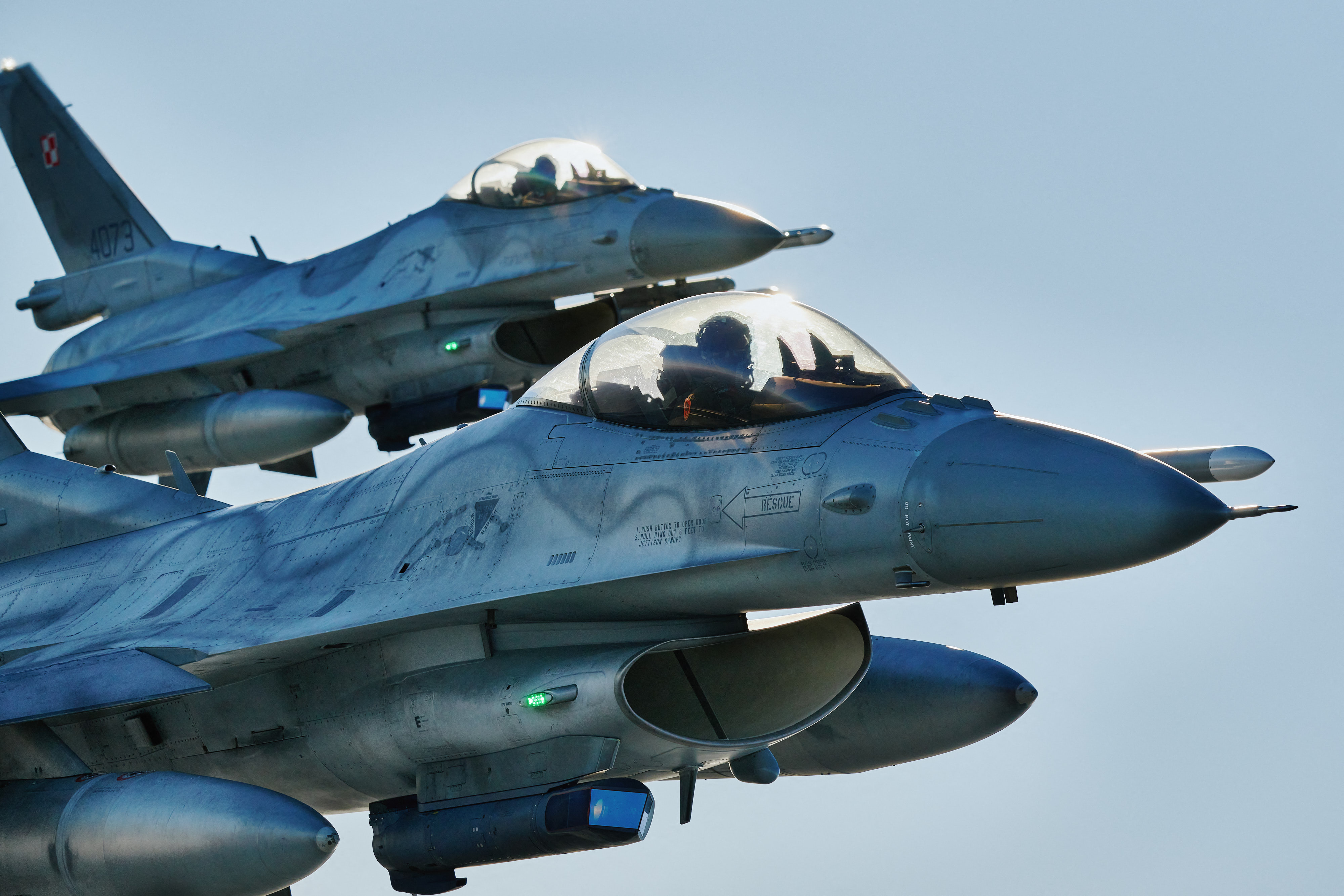 F 16 fighter jets takes part in the NATO Air Shielding exercise near the air base in Lask, central Poland on October 12, 2022. (Photo by RADOSLAW JOZWIAK / AFP) (Photo by RADOSLAW JOZWIAK/AFP via Getty Images)