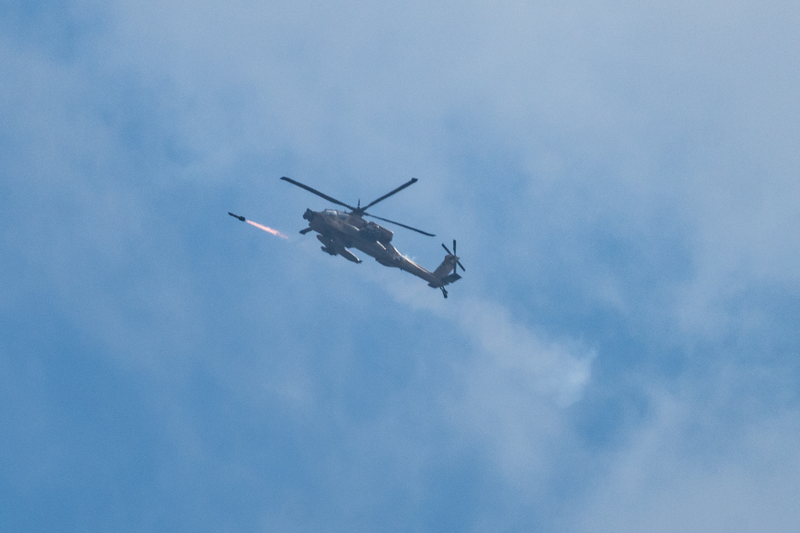 01 October 2024, Israel, ---: An Israeli military helicopter fires a missile at Lebanon. Photo: Ilia yefimovich/dpa (Photo by Ilia yefimovich/picture alliance via Getty Images)