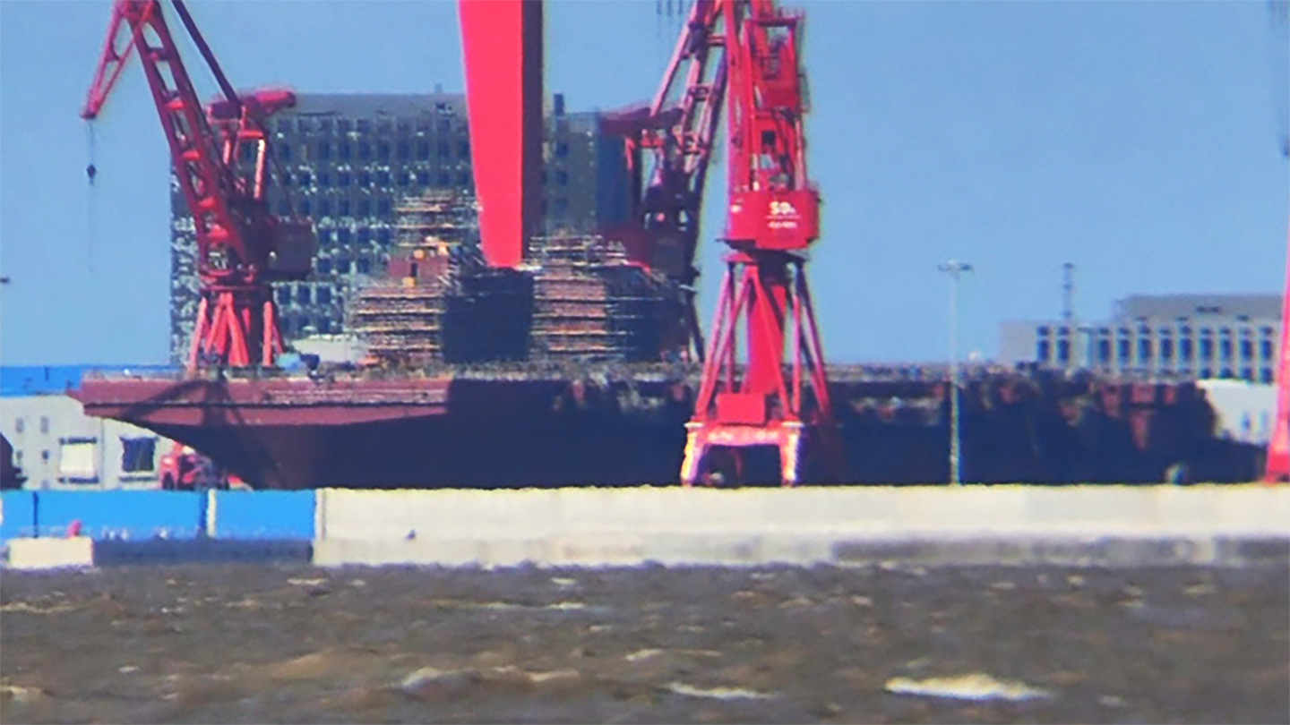 Recent photos of the first of the Type 076 landing helicopter dock (LHD) ships — known in the West as the Yulan class — under construction at the yard on Changxing Island in Shanghai reveal first one island superstructure added to the deck, followed by another, installed as of late last month.