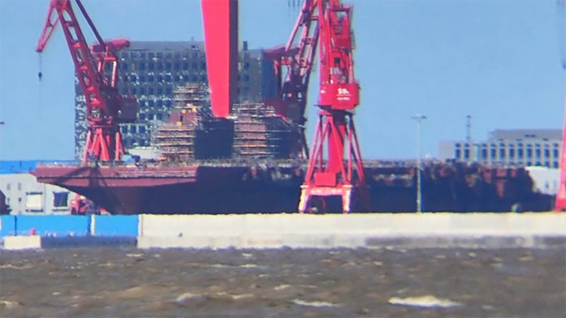 Recent photos of the first of the Type 076 landing helicopter dock (LHD) ships — known in the West as the Yulan class — under construction at the yard on Changxing Island in Shanghai reveal first one island superstructure added to the deck, followed by another, installed as of late last month.