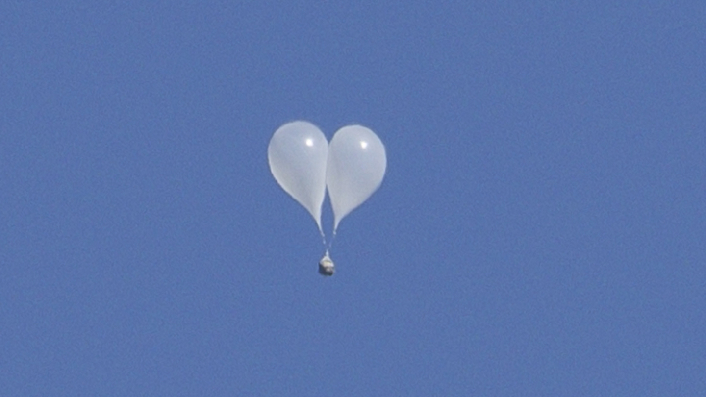 Trash-carrying balloons launched across the border by North Korea are seen floating in the sky above Seoul on October 4, 2024. Relations between the two Koreas are at one of their lowest points in years, with Pyongyang ramping up weapons tests and bombarding the South with balloons carrying rubbish, and Seoul suspending a military deal and resuming propaganda broadcasts in response.