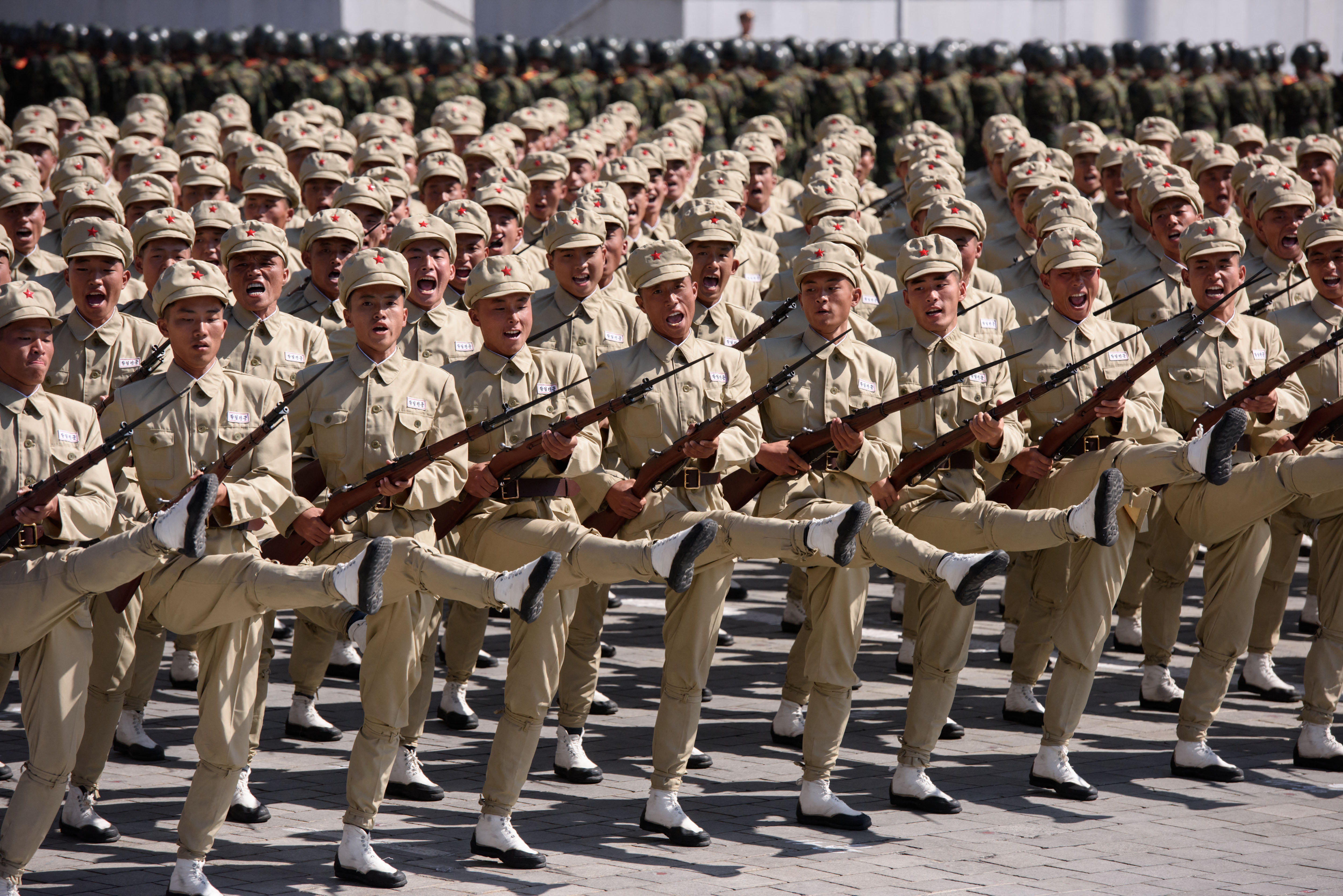 TOPSHOT - Korean People's Army (KPA) soldiers march during a mass rally on Kim Il Sung square in Pyongyang on September 9, 2018. North Korea was marking the 70th anniversary of its founding.Korean People's Army (KPA) tanks take part in a military parade on Kim Il Sung square in Pyongyang on September 9, 2018. (Photo by Ed JONES / AFP) / "The erroneous mention[s] appearing in the metadata of this photo has been modified in AFP systems in the following manner: [BYLINE - ED JONES]. Please immediately remove the erroneous mention[s] from all your online services and delete it (them) from your servers. If you have been authorized by AFP to distribute it (them) to third parties, please ensure that the same actions are carried out by them. Failure to promptly comply with these instructions will entail liability on your part for any continued or post notification usage. Therefore we thank you very much for all your attention and prompt action. We are sorry for the inconvenience this notification may cause and remain at your disposal for any further information you may require." (Photo by ED JONES/AFP via Getty Images)