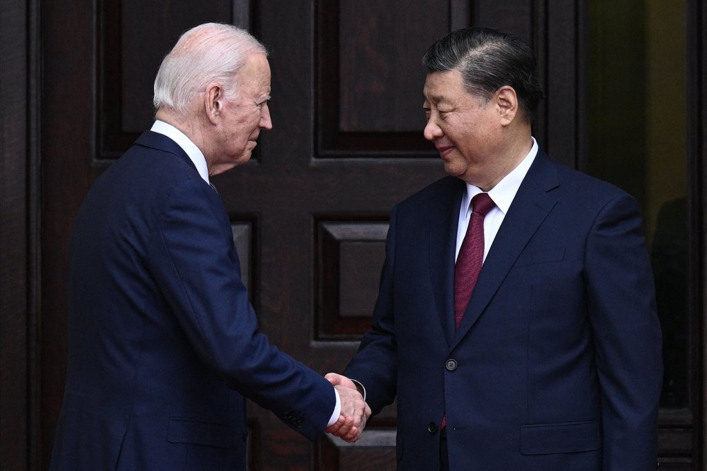 TOPSHOT - US President Joe Biden greets Chinese President Xi Jinping before a meeting during the Asia-Pacific Economic Cooperation (APEC) Leaders' week in Woodside, California on November 15, 2023. Biden and Xi will try to prevent the superpowers' rivalry spilling into conflict when they meet for the first time in a year at a high-stakes summit in San Francisco on Wednesday. With tensions soaring over issues including Taiwan, sanctions and trade, the leaders of the world's largest economies are expected to hold at least three hours of talks at the Filoli country estate on the city's outskirts. (Photo by Brendan SMIALOWSKI / AFP) (Photo by BRENDAN SMIALOWSKI/AFP via Getty Images)