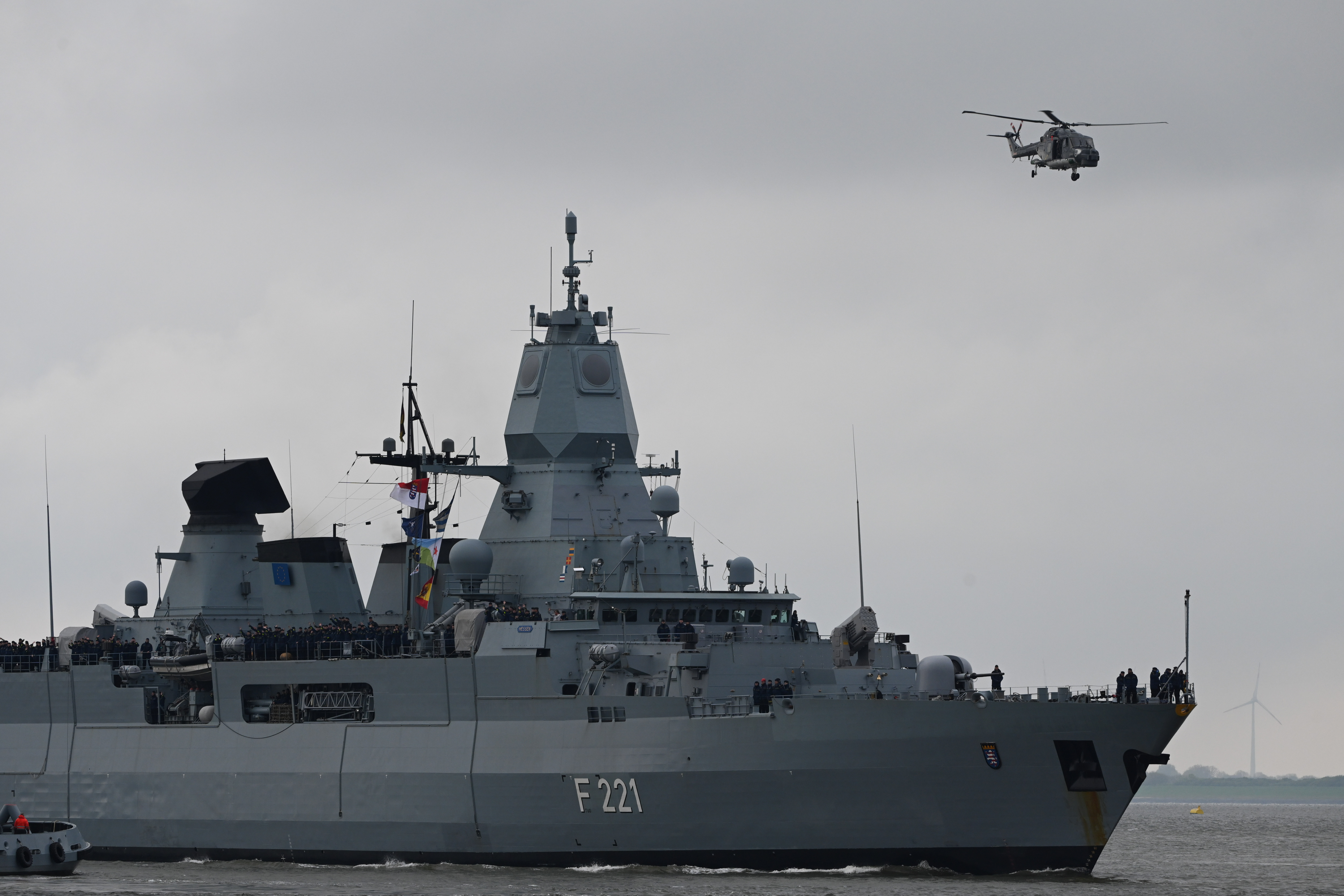 05 May 2024, Lower Saxony, Wilhelmshaven: Accompanied by the "Sea Lynx" on-board helicopter, the frigate "Hessen" enters the port. The frigate "Hessen" returns to Wilhelmshaven after a mission in the Red Sea. Photo: Lars Penning/dpa (Photo by Lars Penning/picture alliance via Getty Images)