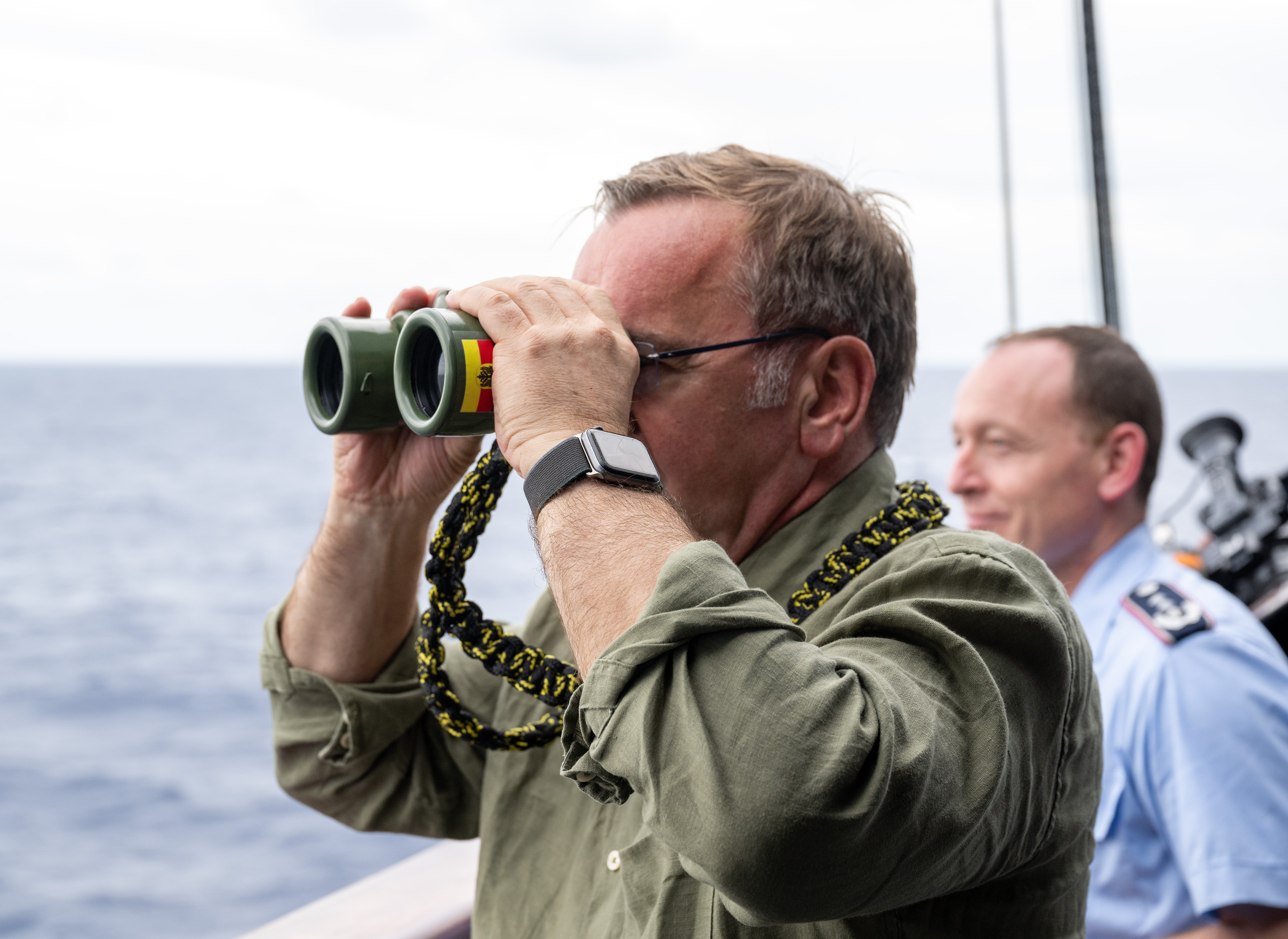 31 July 2024, USA, Honolulu: Boris Pistorius (l, SPD), Federal Minister of Defense, stands on board the German frigate "Baden-Württemberg" and looks through binoculars during the US-led military exercise Rim of the Pacific (RIMPAC, 26.06. to 02.08.2024). Photo: Soeren Stache/dpa (Photo by Soeren Stache/picture alliance via Getty Images)