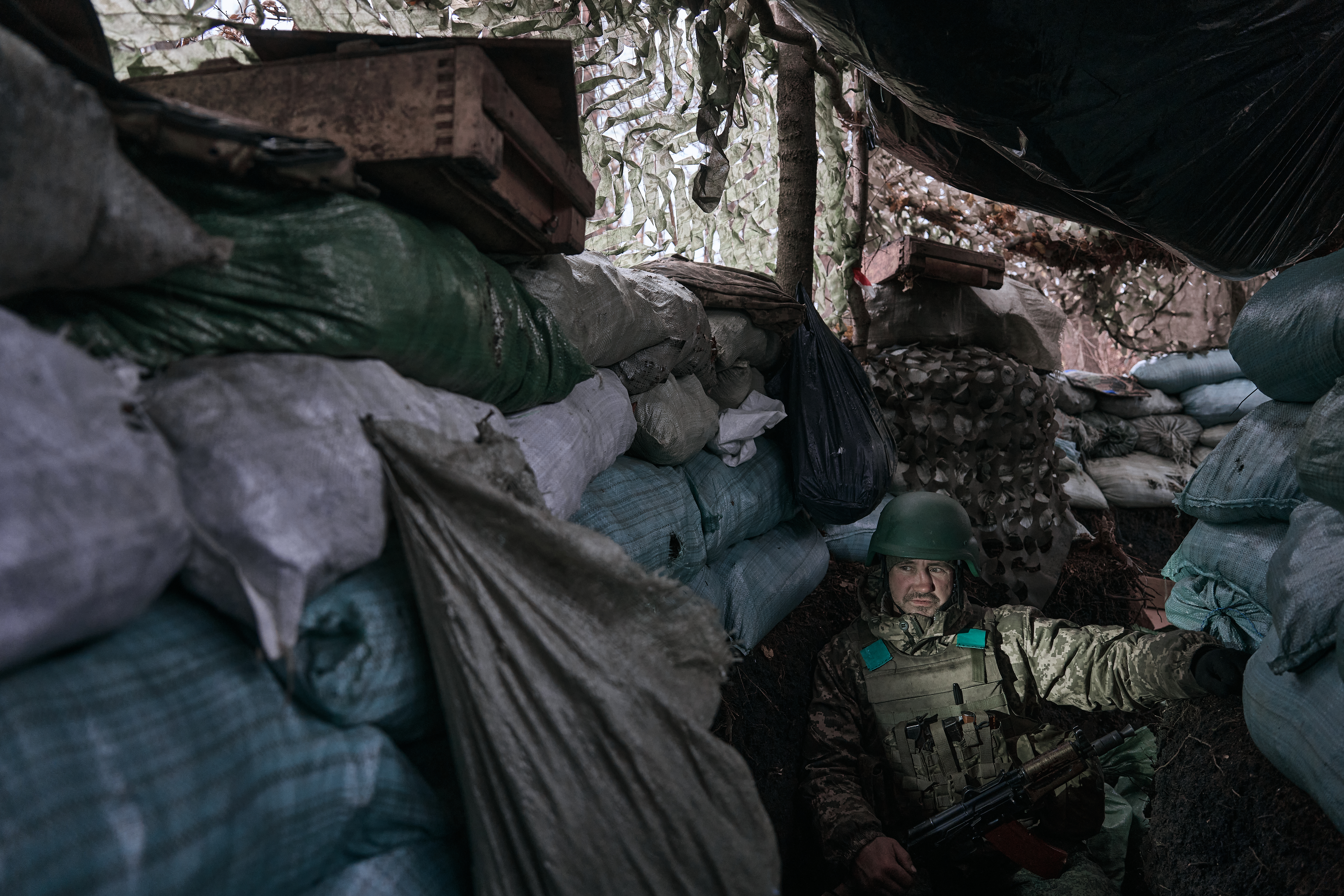 KREMINNA, UKRAINE - NOVEMBER 6: A soldier in a trench 100 meters from the Russian positions in the Serebryansky forest on November 6, 2024 in Serebryansky Reserve, Ukraine. The forest is located about 8 kilometers southwest of Kreminna in the Luhansk Oblast Ukraine. Fighting has raged for months in this forest west of Russian-held Ukrainian cities Lysychansk and Severodonetsk. (Photo by Kostiantyn Liberov/Libkos/Getty Images)