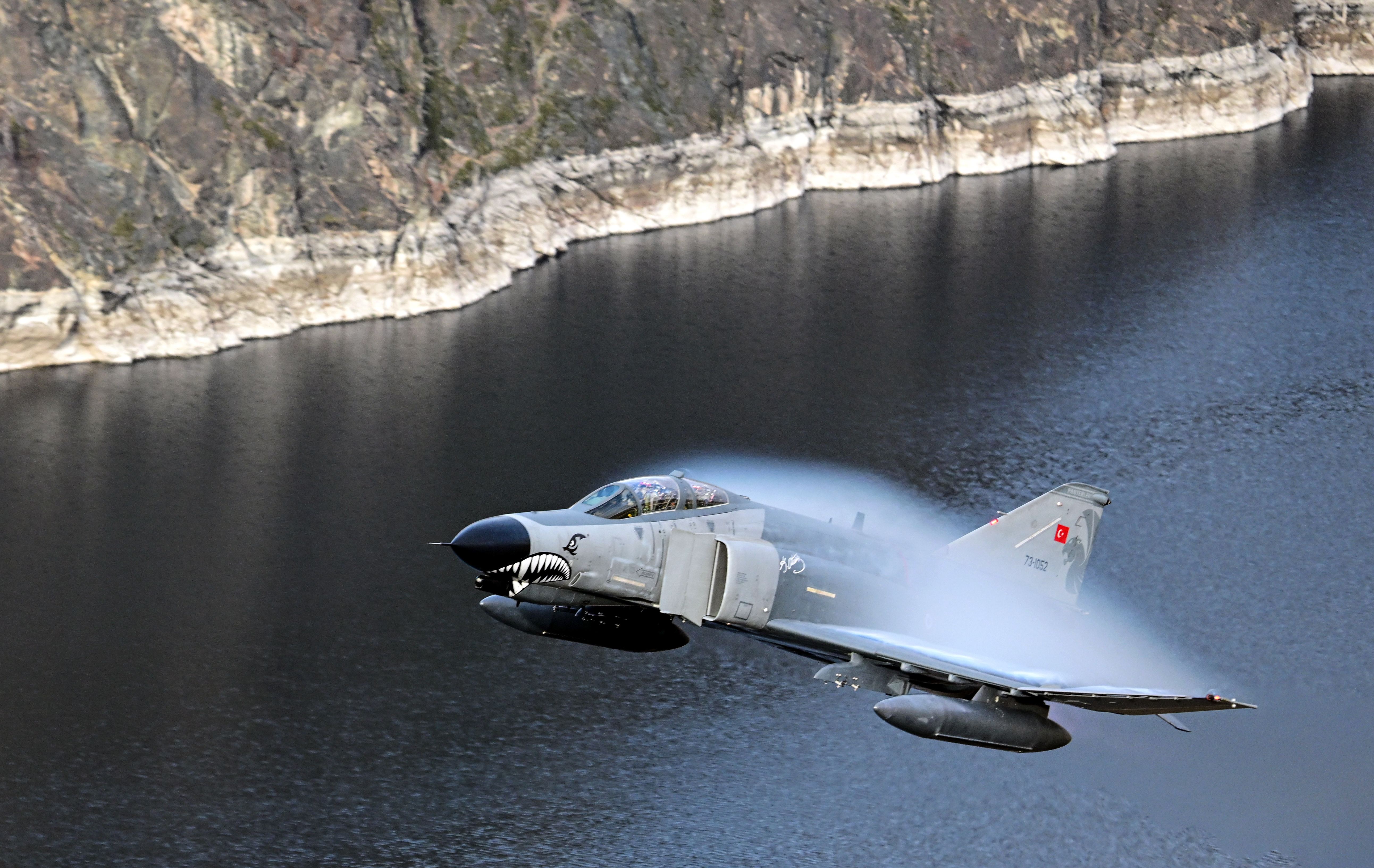 ESKISEHIR, TURKIYE - NOVEMBER 16: A military aircraft performs a "Low Altitude Training" flight within the scope of the 50th anniversary of the entry of F-4E Phantom aircraft into the Turkish Air Force inventory in Eskisehir, Turkiye on November 16, 2024. (Photo by Ali Atmaca/Anadolu via Getty Images)