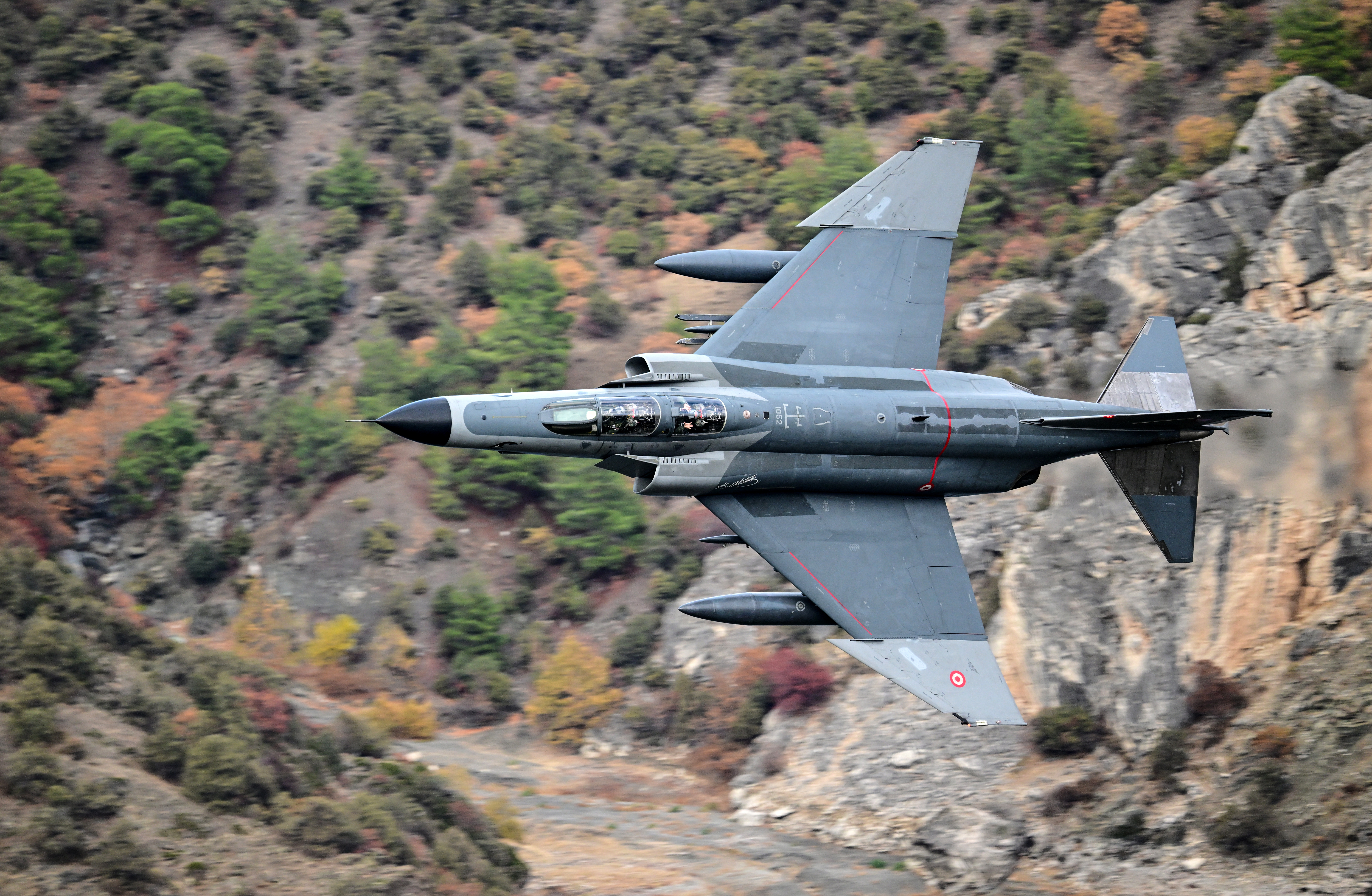 ESKISEHIR, TURKIYE - NOVEMBER 16: A Turkish Air Force F-4E Phantom II, adorned with a striking Turkish flag livery, soars in a low-altitude maneuver over Eskisehir to commemorate 50 years of service in the Turkish Air Force in Eskisehir, Turkiye on November 16, 2024. (Photo by Ali Atmaca/Anadolu via Getty Images)