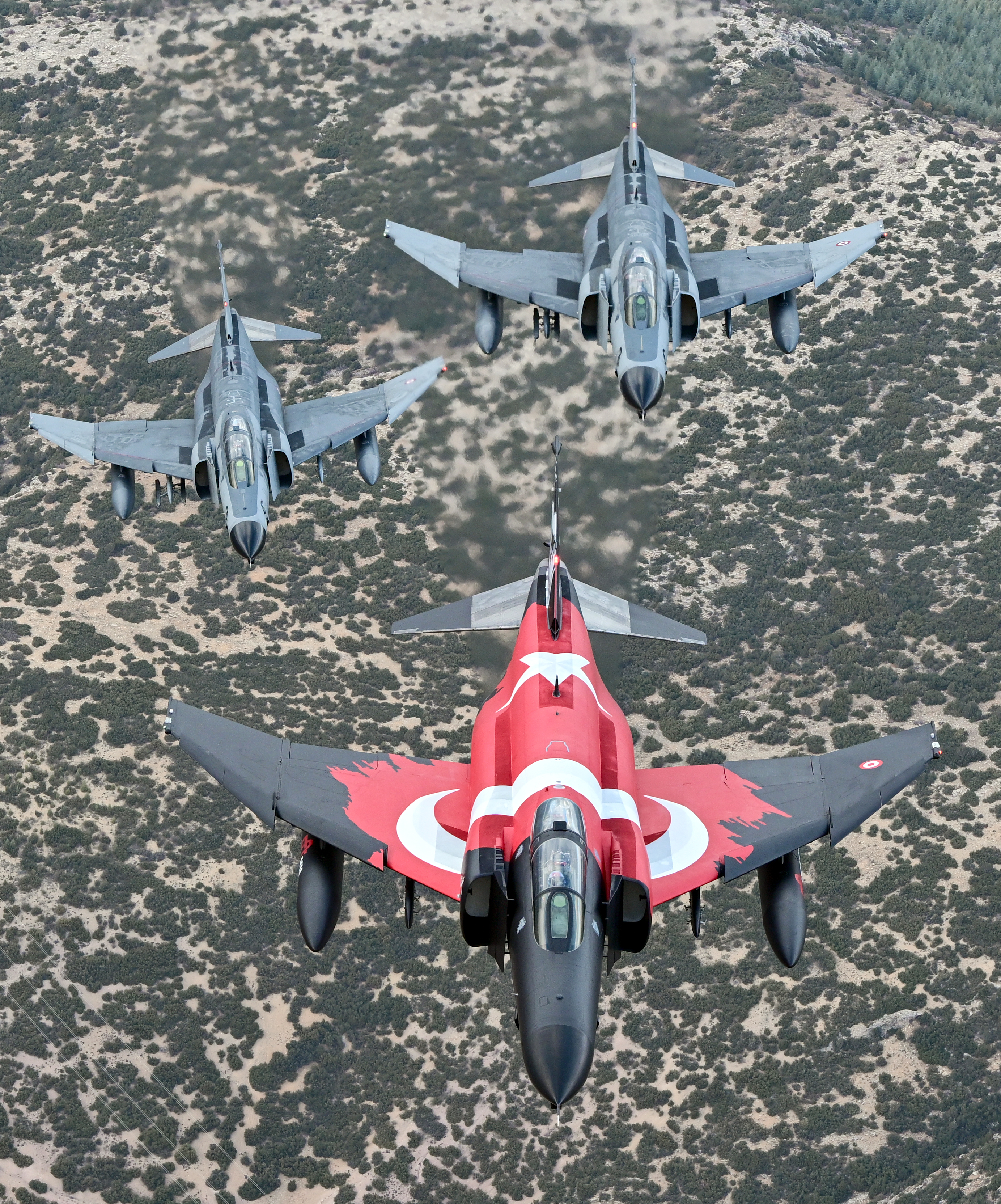 ESKISEHIR, TURKIYE - NOVEMBER 15: F-4E Phantom II, one with a Turkish flag take part in training flight to commemorate 50 years of service in the Turkish Air Force in Eskisehir, Turkiye on November 15, 2024. (Photo by Ali Atmaca/Anadolu via Getty Images)