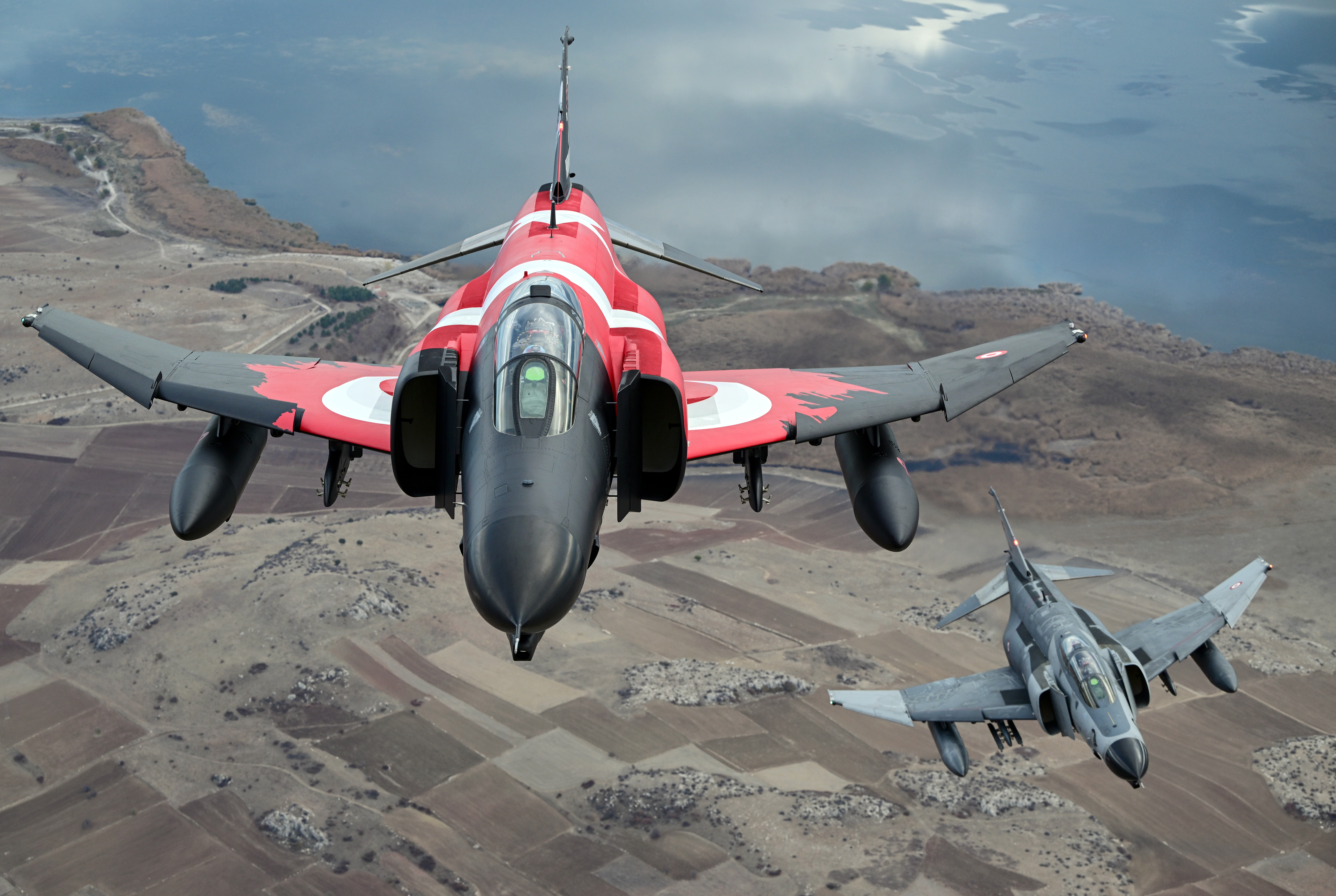 ESKISEHIR, TURKIYE - NOVEMBER 15: F-4E Phantom II, one with a Turkish flag take part in training flight to commemorate 50 years of service in the Turkish Air Force in Eskisehir, Turkiye on November 15, 2024. (Photo by Ali Atmaca/Anadolu via Getty Images)