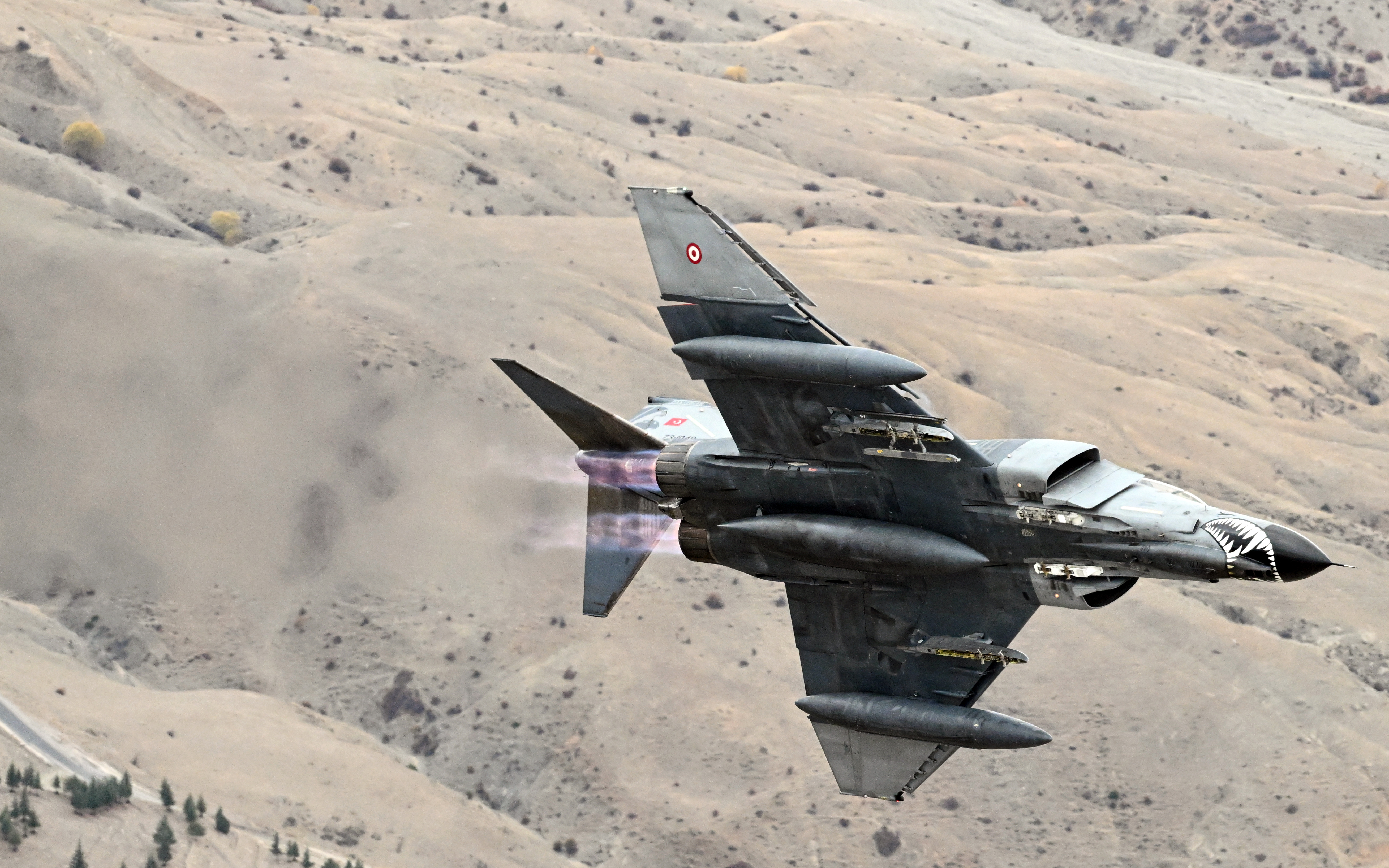 ESKISEHIR, TURKIYE - NOVEMBER 15: Turkish Air Force F-4E Phantom II, decorated with a Turkish flag, take part in training flight to commemorate 50 years of service in the Turkish Air Force in Eskisehir, Turkiye on November 15, 2024. (Photo by Ali Atmaca/Anadolu via Getty Images)