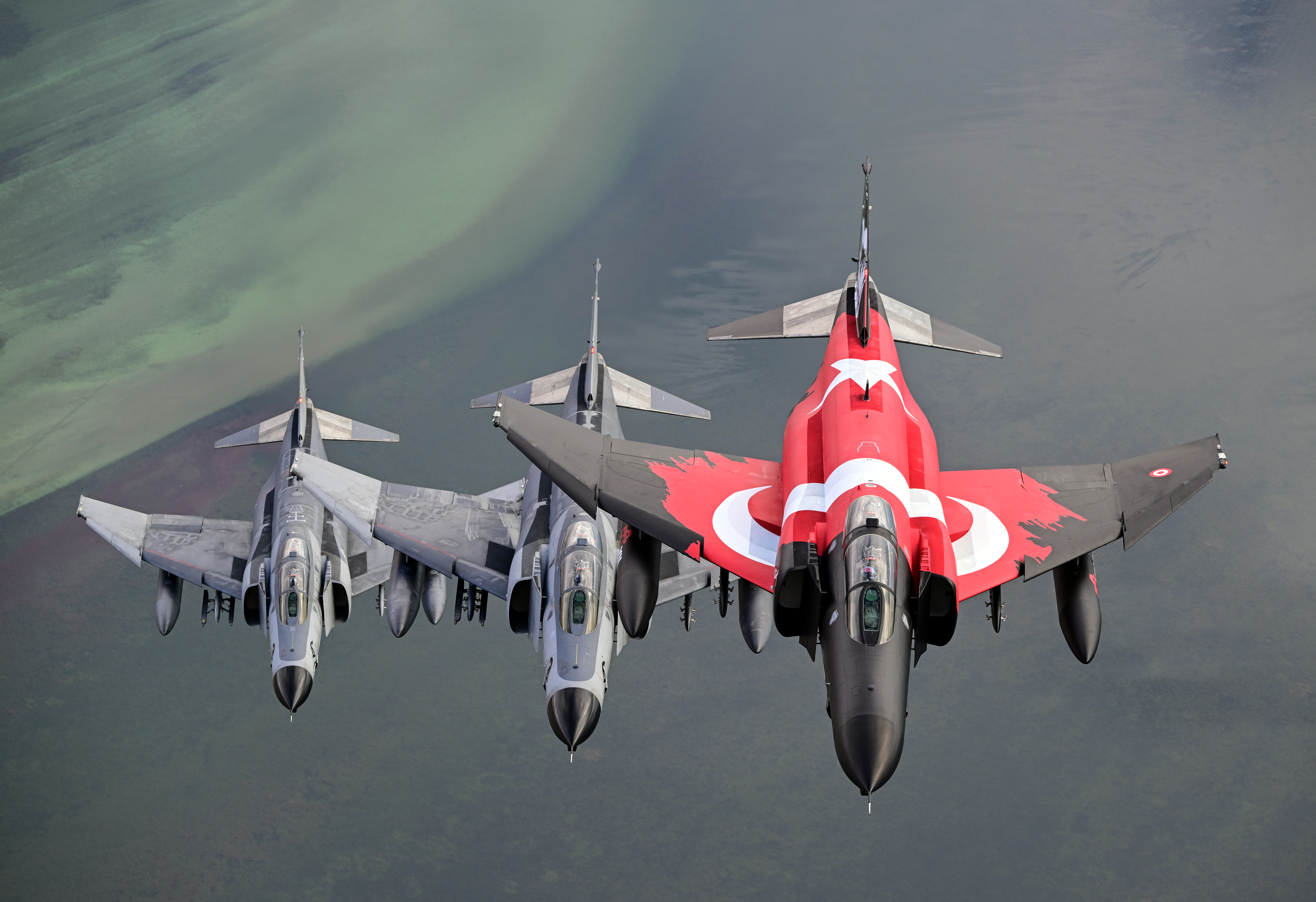 ESKISEHIR, TURKIYE - NOVEMBER 15: F-4E Phantom II, one with a Turkish flag take part in training flight to commemorate 50 years of service in the Turkish Air Force in Eskisehir, Turkiye on November 15, 2024. (Photo by Ali Atmaca/Anadolu via Getty Images)