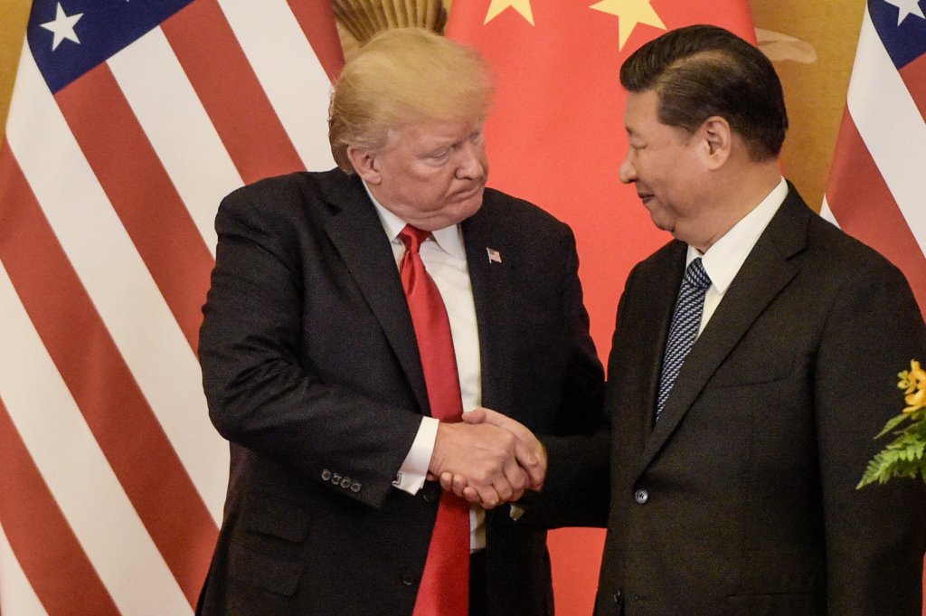 TOPSHOT - US President Donald Trump (L) shakes hand with China's President Xi Jinping at the end of a press conference at the Great Hall of the People in Beijing on November 9, 2017. - Donald Trump and Xi Jinping put their professed friendship to the test on November 9 as the least popular US president in decades and the newly empowered Chinese leader met for tough talks on trade and North Korea. (Photo by Fred DUFOUR / AFP) (Photo by FRED DUFOUR/AFP via Getty Images)