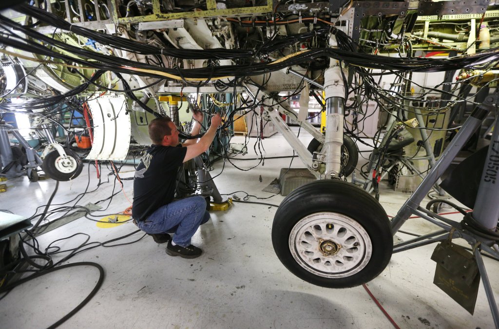 OGDEN, UT - DECEMBER 20: An aircraft mechanic works on then underside of an F-16 Falcon on December 20, 2017 at Hill Air Force base in Ogden, Utah. Hill Air Force Base has one of the largest repair facilitates for A-10's and F-16's fighter jets and is preparing to expand and increase their maintenance capabilities for both planes. (Photo by George Frey/Getty Images)