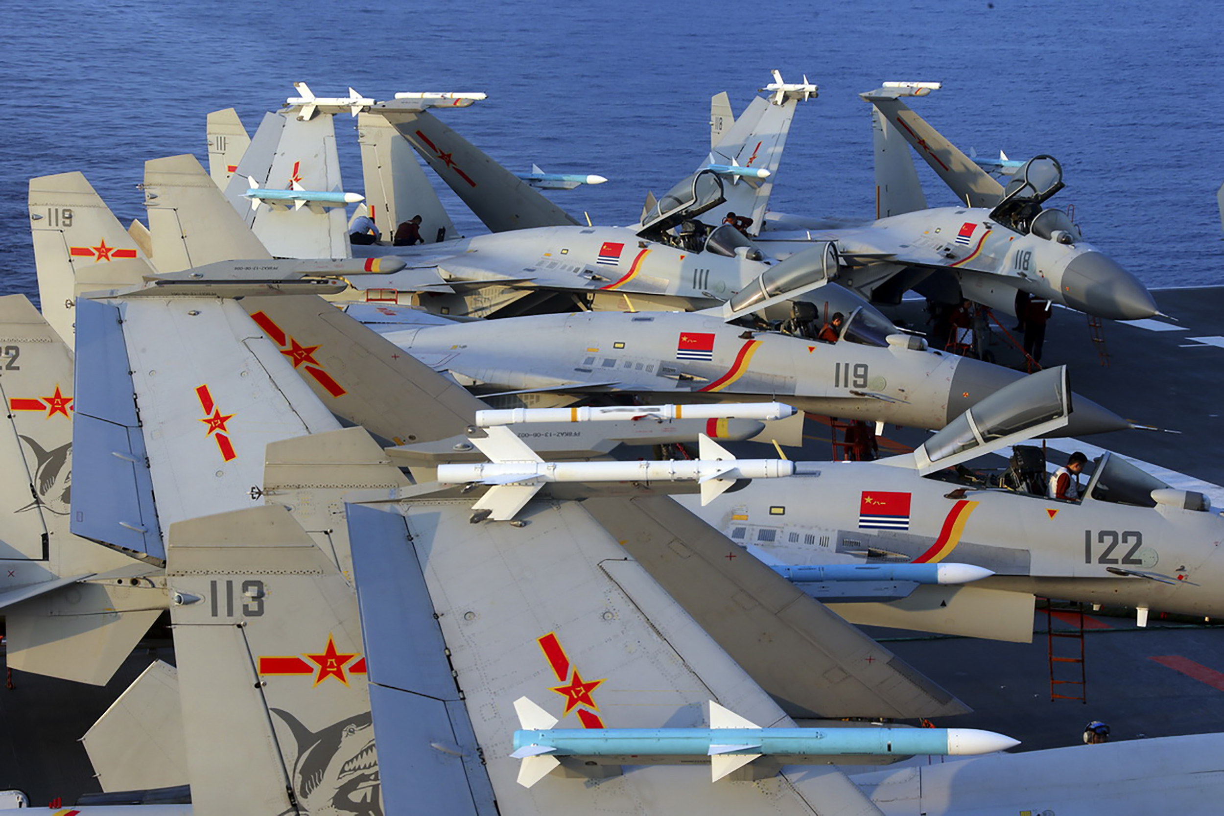 This undated photo taken in April 2018 shows J15 fighter jets on China's sole operational aircraft carrier, the Liaoning, during a drill at sea. - A flotilla of Chinese naval vessels held a "live combat drill" in the East China Sea, state media reported early April 23, 2018, the latest show of force by Beijing's burgeoning navy in disputed waters that have riled neighbours. (Photo by - / AFP) / China OUT (Photo credit should read -/AFP via Getty Images)