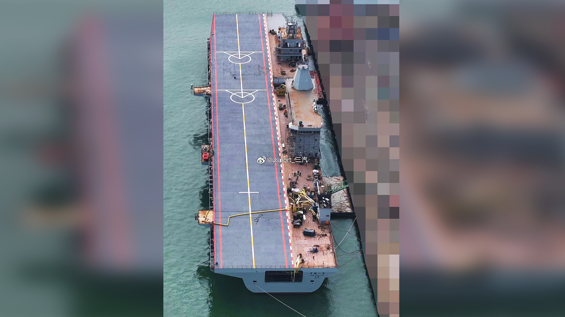 Additional photos provide a much more detailed look at the mysterious Chinese flattop that TWZ was first to report on, and which recently went to sea, apparently for its first trials. While the function of this vessel remains unknown, the recently published photos do confirm that it’s intended to operate rotary-wing aircraft (perhaps in addition to fixed-wing drones), but there are no obvious signs of catapults or arrester cables of the kind that would be used for operating heavier fixed-wing types. There is also no indication that the vessel has a floodable well-deck like those found on many amphibious warfare ships.