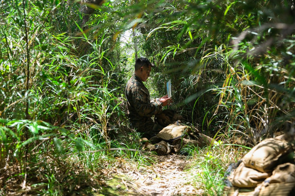 U.S. Marine Corps Staff Sgt. Tyler Ochs, a platoon commander with 1st Battalion, 6th Marine Regiment, currently attached to 3rd Marine Division under the Unit Deployment Program, sets up defensive positions during an Expeditionary Advance Base Operation exercise at the Northern Training Area, Okinawa, Japan, June 17, 2020. This 1st Battalion, 6th Marine Regiment-led exercise also features participation from 3rd Reconnaissance Battalion and High Mobility Artillery Rocket Systems from 3rd Battalion, 12th Marine Regiment. Training events like this strengthen 3rd Marine Division’s ability to control key terrain in a contested battlespace. Ochs is a native of Fond du Lac, Wisconsin (U.S. Marine Corps photo by Cpl. Donovan Massieperez)