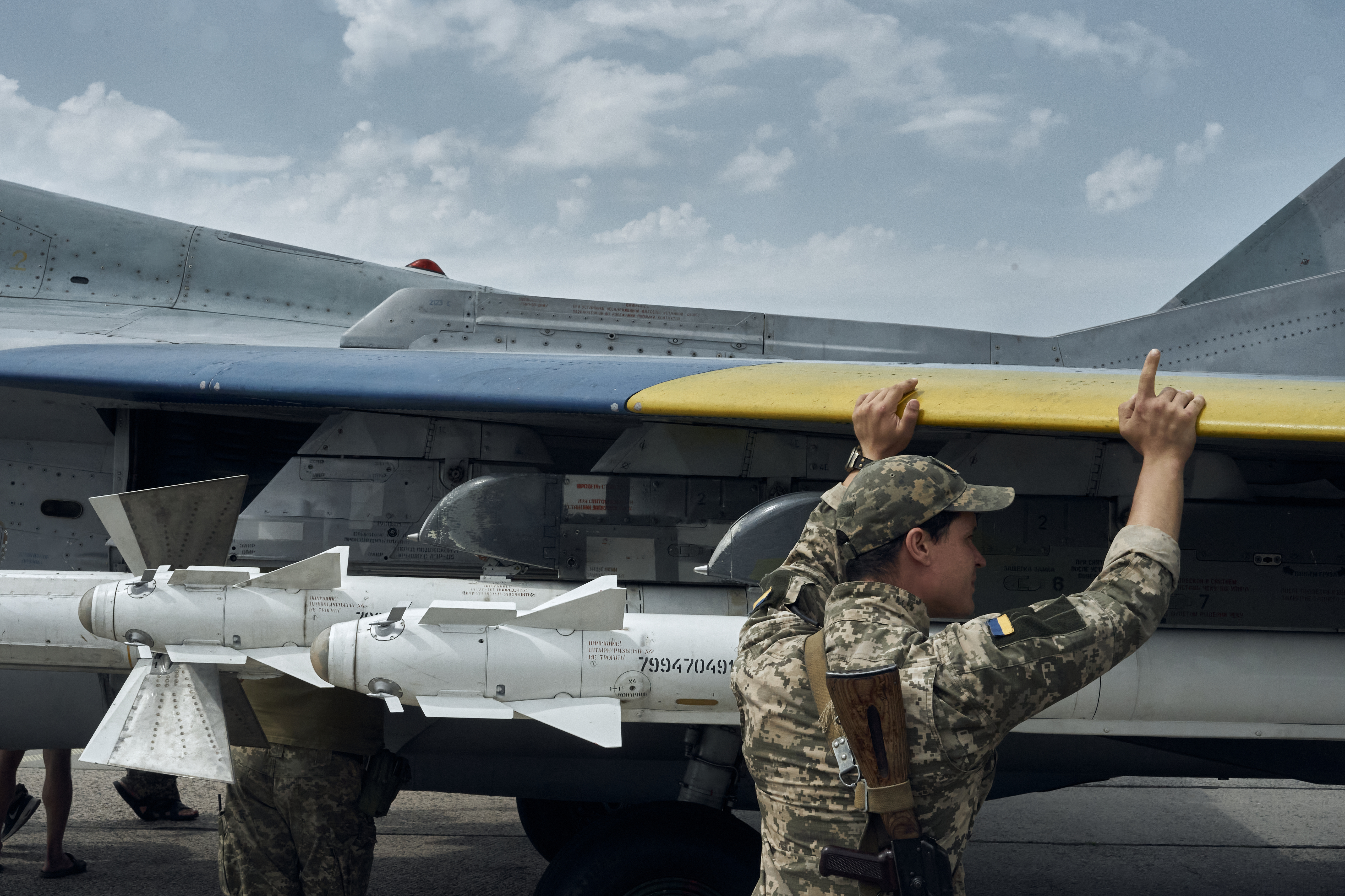 EASTERN UKRAINE - AUGUST 2: The Ukrainian MIG-29 pilot returns to the airfield after a combat mission mission on August 2, 2023 in eastern Ukraine. The maintenance staff perform routine upkeep of the aircraft after the flight. on August 2, 2023 in eastern Ukraine. Earlier this year, several NATO members committed to providing warplanes to Ukraine, including Poland and Slovakia, who announced the transfer of MiG-29s. The planes had been used by Ukraine since before Russia's large-scale invasion in February 2022 and Ukrainian pilots were familiar with the Soviet-era aircraft. (Photo by Libkos/Getty Images)