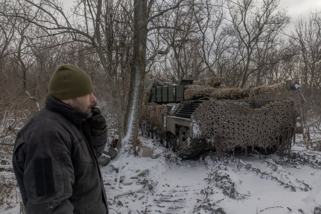 A Ukrainian tank crew member of the 68th Jaeger Brigade smokes next to a Leopard 1A5 tank at the position where they take a break in fighting, near Pokrovsk, the eastern Donetsk region, on December 13, 2024, amid the Russian invasion of Ukraine. (Photo by Roman PILIPEY / AFP) (Photo by ROMAN PILIPEY/AFP via Getty Images)