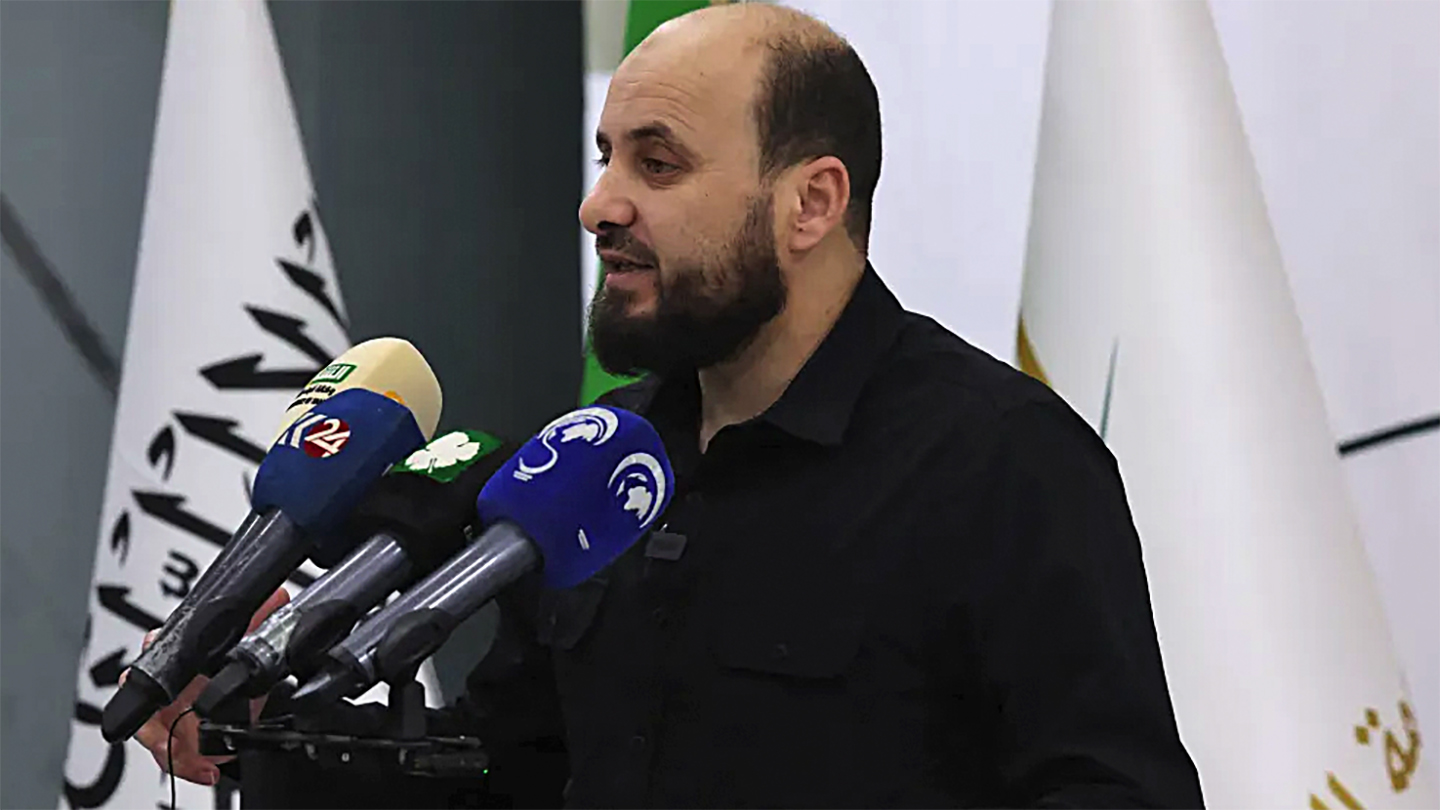 Mohamed Bashir, who heads HTS's so-called "Salvation Government", holds a press conference in the rebel-held northwestern Syrian city of Idlib on November 28, 2024. The Syrian rebels now in power in Damascus have appointed Mohammed al-Bashir as head of a transitional government that will be in place until March 1, state media said on December 10, 2024. (Photo by Omar HAJ KADOUR / AFP) (Photo by OMAR HAJ KADOUR/AFP via Getty Images)