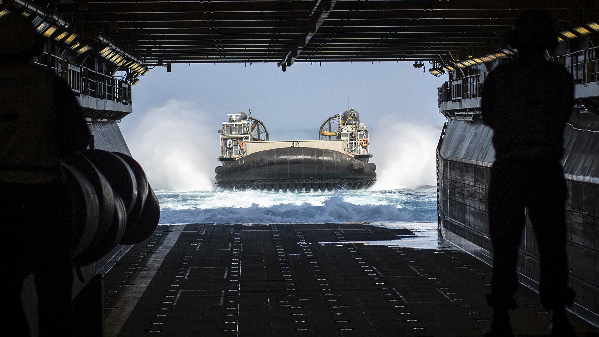 PACIFIC OCEAN (May 11, 2021) A U.S. Navy Landing Craft, Air Cushion with Assault Craft Unit 5 prepares to enter the well deck of amphibious assault ship USS Essex (LHD 2), May 11. Essex is underway as part of the Essex Amphibious Ready Group conducting routine training off the coast of southern California with the 11th Marine Expeditionary Unit. (U.S. Marine Corps photo by Cpl. Israel Chincio)