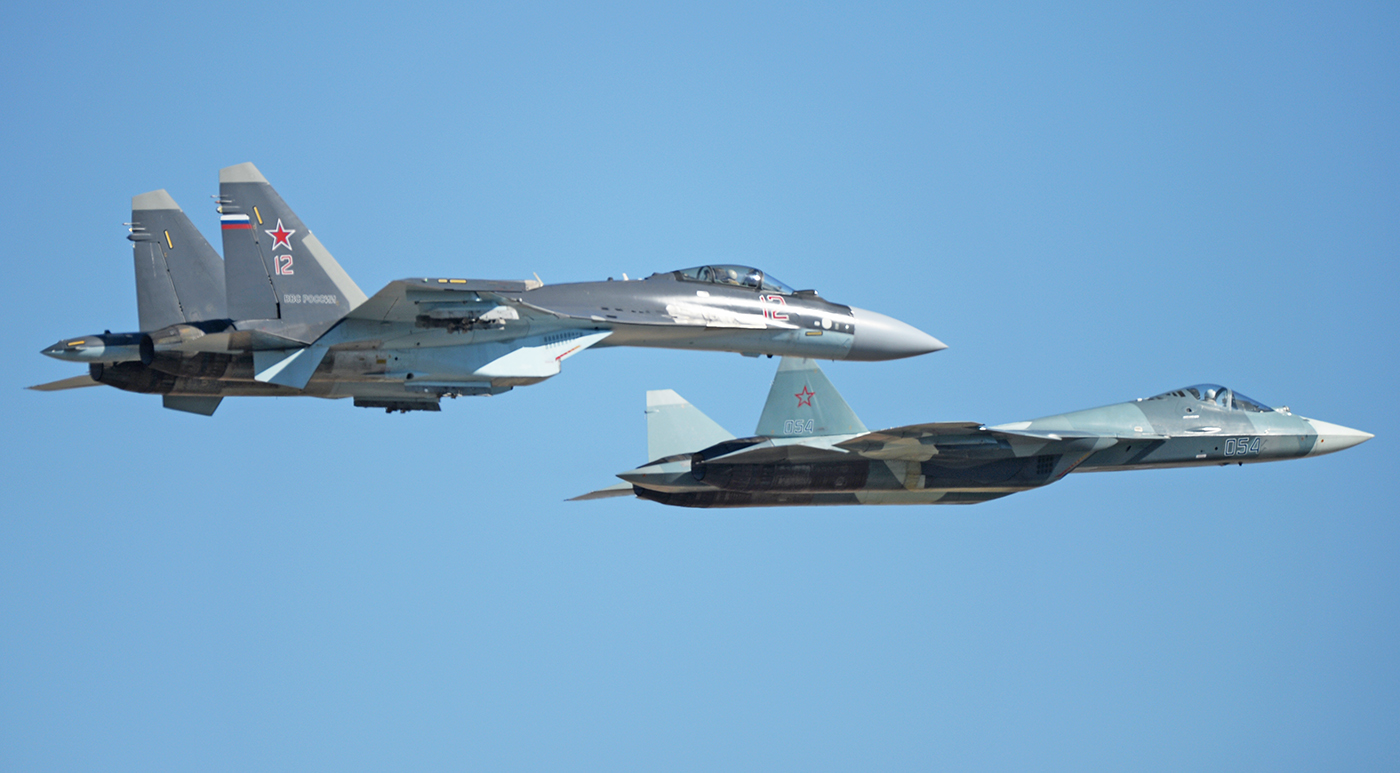 2706341 09/26/2015 A Su-35, left, and T-50 aircraft at the air show in Akhtubinsk which is dedicated to the 95th anniversary of the establishment of the Russian Defense Ministry's flight test center. Mikhail Voskresenskiy/Sputnik via AP