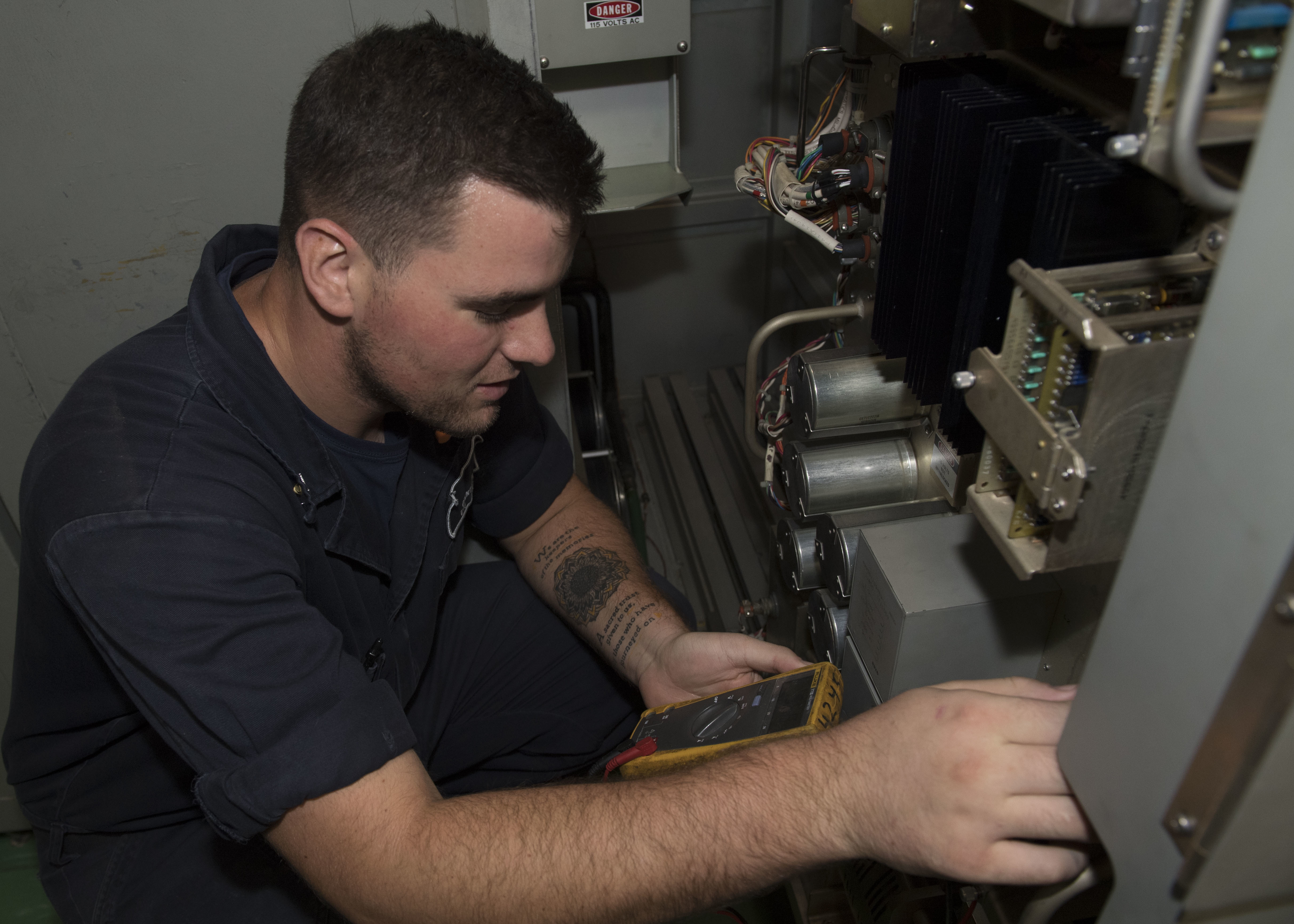 171004-N-MZ078-110 ARABIAN GULF (Oct. 4, 2017) Electronics Technician 3rd Class Brent Vigil, from San Diego, runs diagnostic testing on an antenna aboard the Ticonderoga-class guided-missile cruiser USS Lake Erie (CG 70) during a replenishment-at-sea. Lake Erie is deployed to the U.S. 5th Fleet area of operations in support of maritime security operations to reassure allies and partners, and preserve the freedom of navigation and the free flow of navigation and the free flow of commerce in the region. (U.S. Navy photo by Mass Communication Specialist 3rd Class Lucas T. Hans/Released)