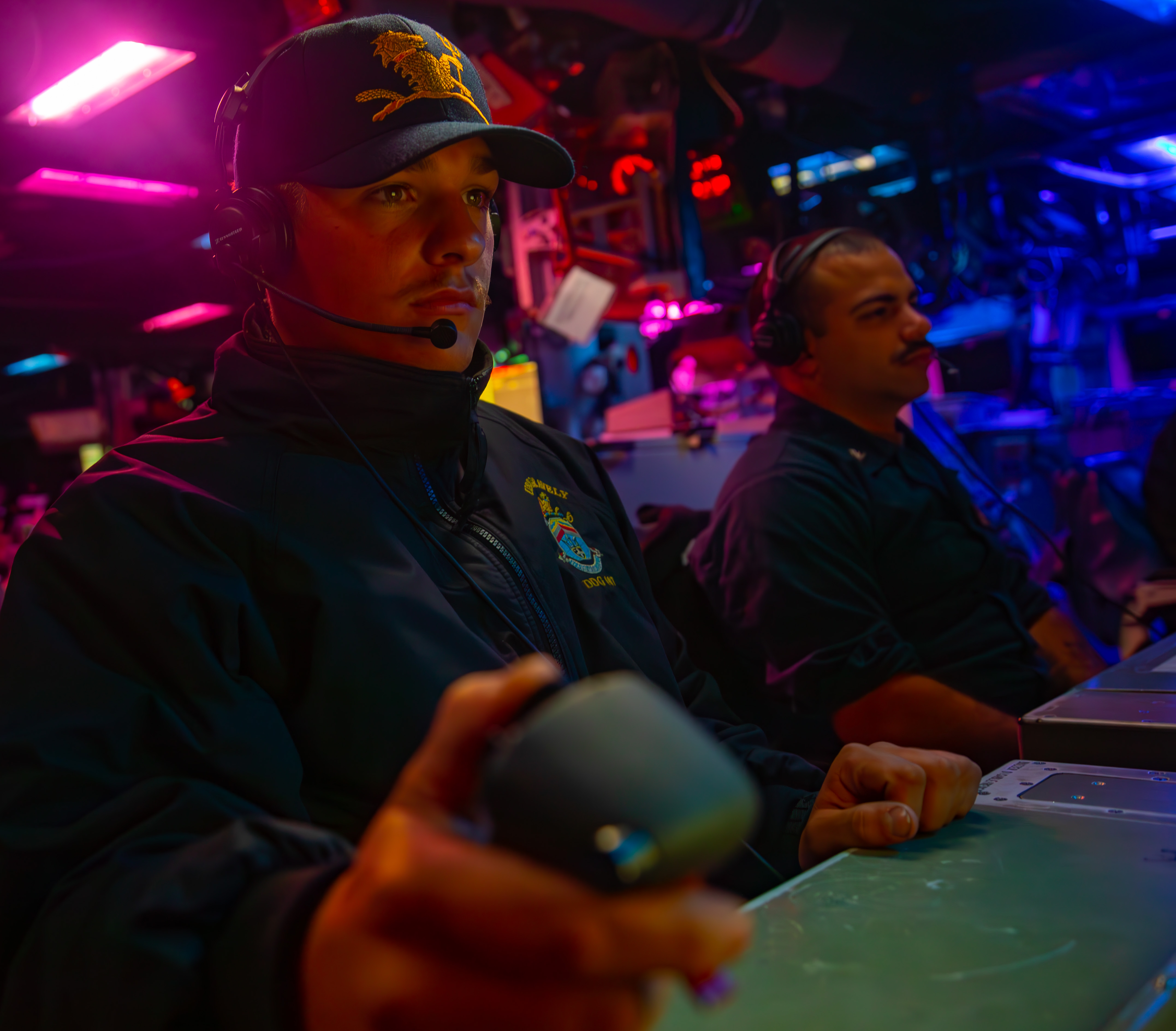 A gunner's mate stands watch on the optical sighting system in the combat information center aboard the Navy destroyer USS Gravely (DDG-107) while transiting the Bab al-Mandeb Strait on Feb. 19, 2024.