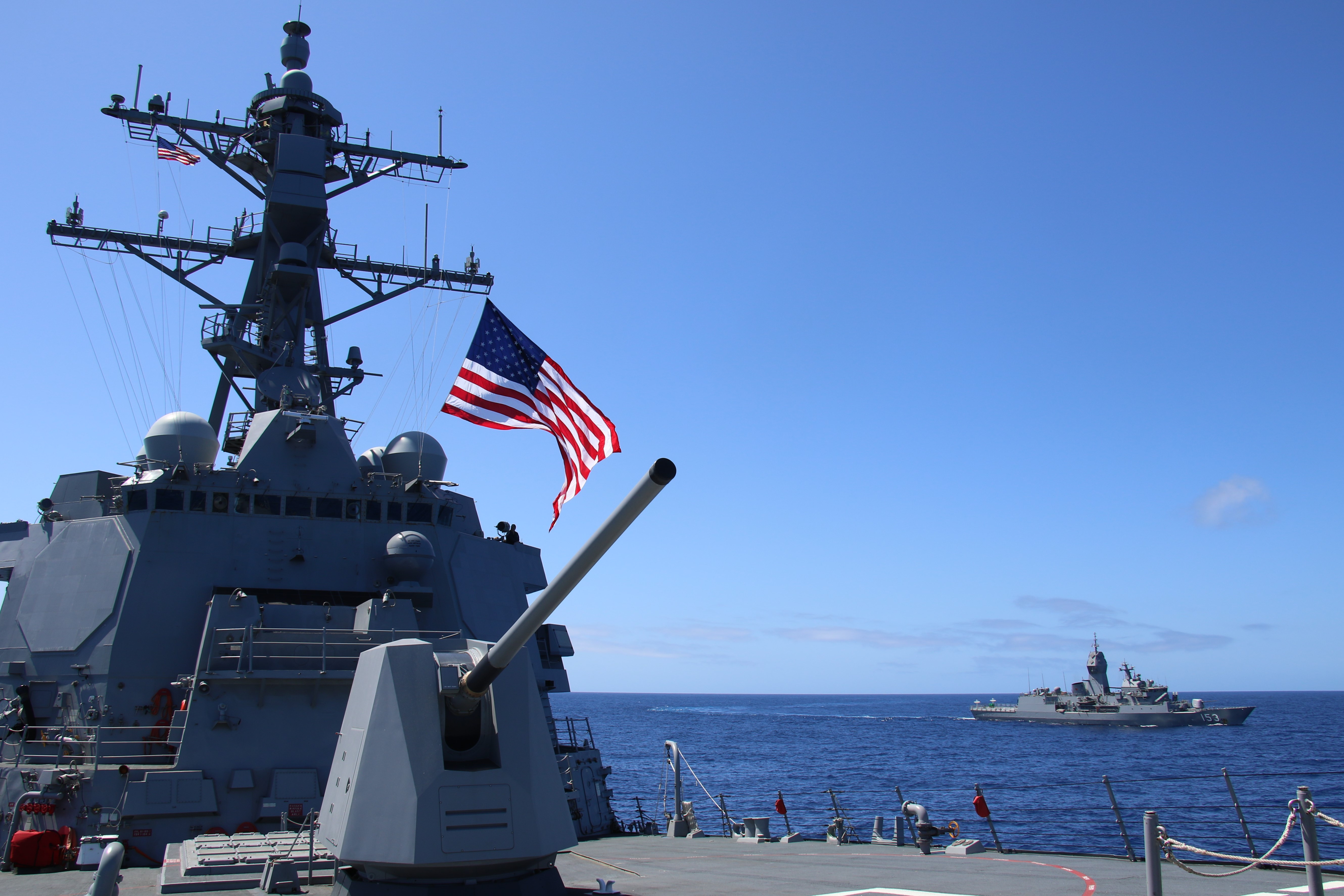 The Navy Flight III destroyer USS Jack H. Lucas (DDG-125) underway with the Australian ANZAC class frigate HMAS Stuart (FFH-153) off Hawaii in March 2024.