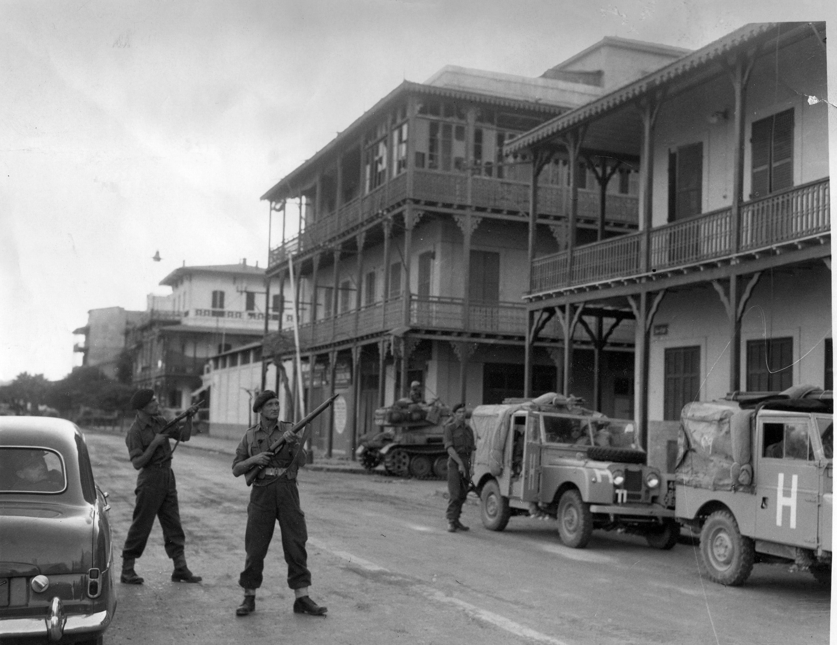 The Suez crisis - Troops on the alert for snipers as the army convoys drive through the streets of Port Said. 8th November 1956. (Photo by NCJ - Kemsley/NCJ Archive/Mirrorpix via Getty Images)