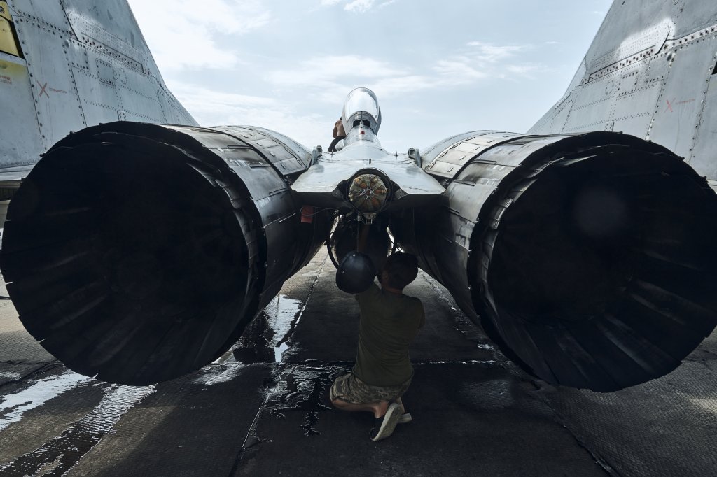 EASTERN UKRAINE - AUGUST 1: The maintenance staff perform routine upkeep of the aircraft after a flight on August 1, 2023 in eastern Ukraine. Earlier this year, several NATO members committed to providing warplanes to Ukraine, including Poland and Slovakia, who announced the transfer of MiG-29s. The planes had been used by Ukraine since before Russia's large-scale invasion in February 2022 and Ukrainian pilots were familiar with the Soviet-era aircraft. (Photo by Libkos/Getty Images)