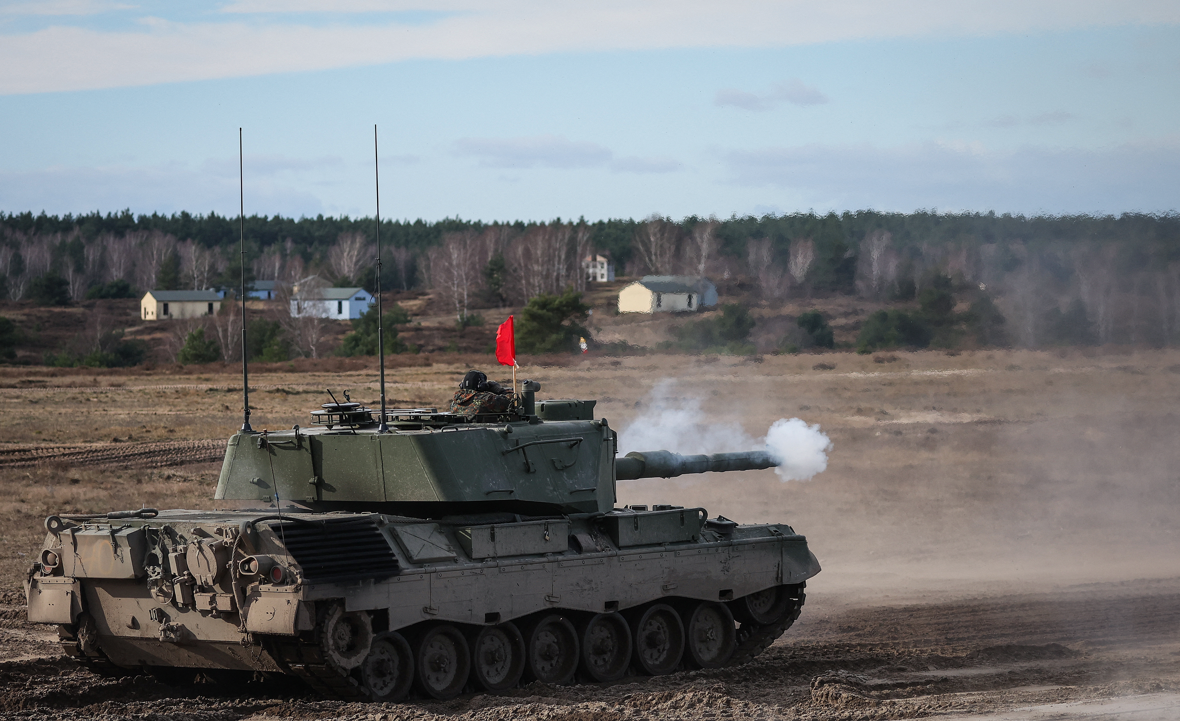 A Leopard 1 A5 combat tank of the German Bundeswehr armed forces fires during a military exercise at the Klietz military training area in Klietz, eastern Germany, on February 23, 2024. Soldiers from Ukraine are currently being trained on the Leopard 1 A5 tank in the German Bundeswehr's troop training centre in Klietz. (Photo by Ronny HARTMANN / AFP) (Photo by RONNY HARTMANN/AFP via Getty Images)