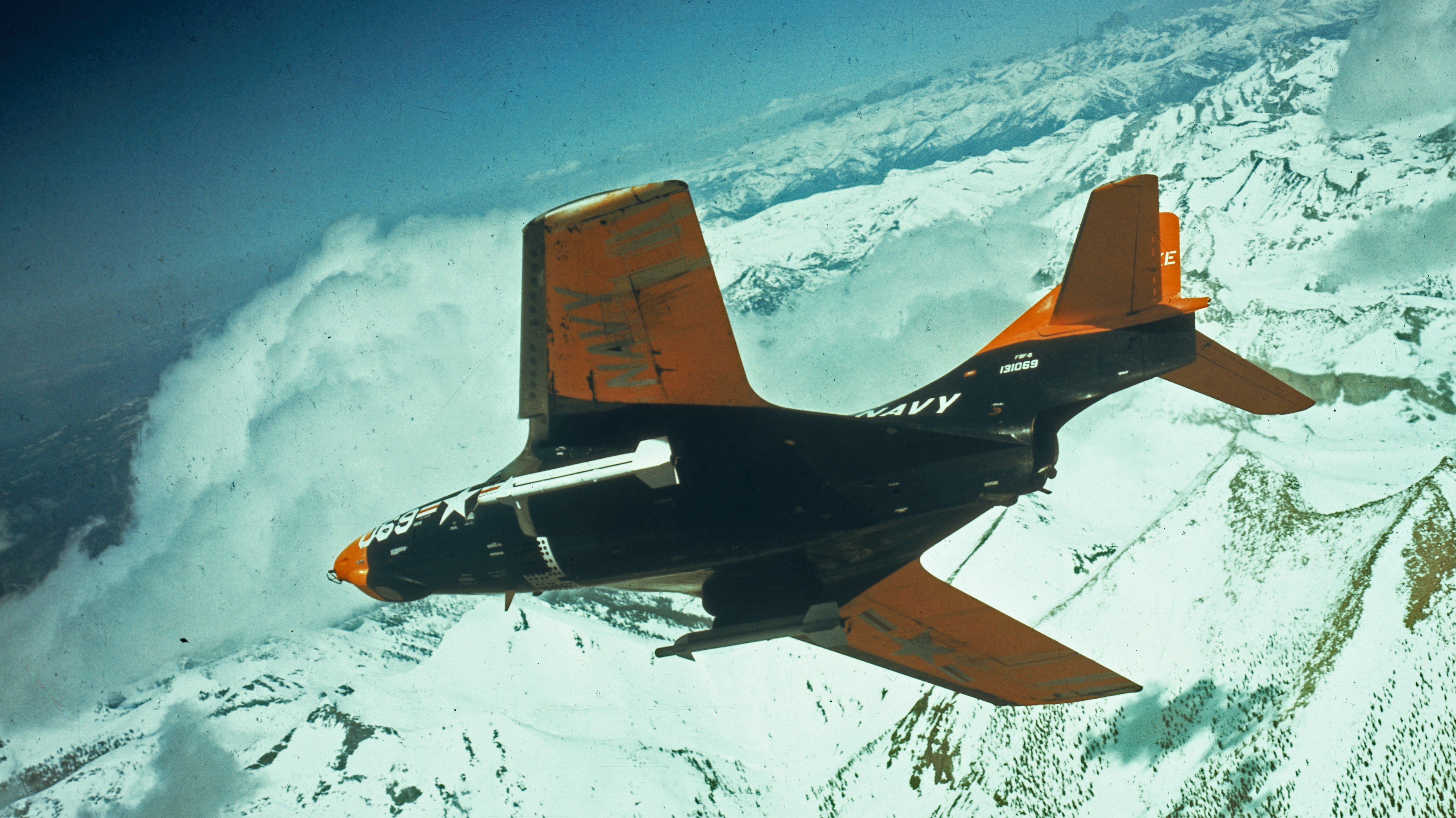 (Original Caption) The Sidewinder, the Navy's newest air-to-air guided missile mounted on a F9F-8 Navy Jet is shown here in this photograph.