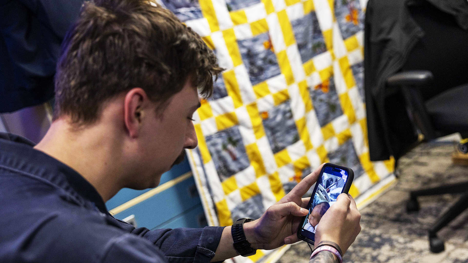 MEDITERRANEAN SEA (Nov. 5, 2024) Damage Controlman 3rd Class Nicholas Ward, assigned to the amphibious assault ship USS Wasp (LHD 1), uses the ship’s Commercial Afloat Transformational Network Integrated Program (CATNIP) to video call his wife and newborn, Nov. 5, 2024. Wasp is conducting operations in the U.S. Naval Forces Europe and Africa (NAVEUR-NAVAF) area of operations as the flagship of the Wasp Amphibious Ready Group (WSP ARG)-24th Marine Expeditionary Unit (MEU) Special Operations Capable (SOC). The WSP ARG-24th MEU (SOC) is on a scheduled deployment to the NAVEUR-NAVAF area of operations, supporting U.S., Allied and partner interests in the region, including in the Eastern Mediterranean Sea, to continue promoting regional stability and deterring aggression. (U.S. Navy photo by Mass Communication Specialist Seaman Seaman Apprentice Soren V.P. Quinata)