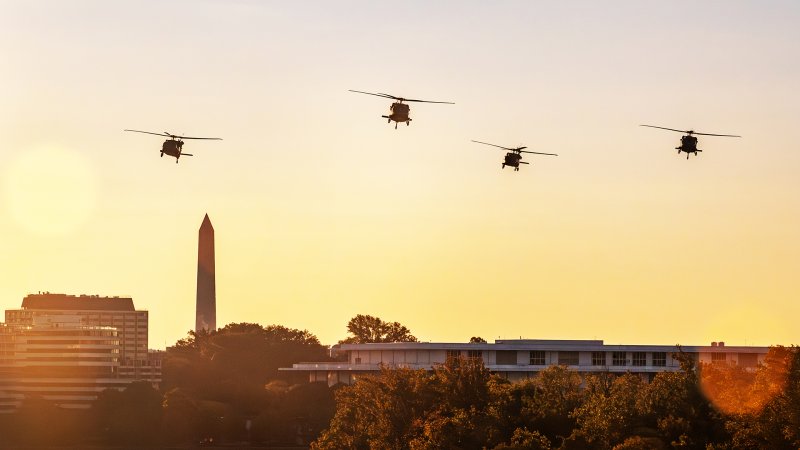 12th Army Aviation Battalion UH-60 Blackhawk helicopters fly in formation over the Potomac River in Washington to help kick off the 39th Annual Army Ten-Miler, Oct. 8, 2023. The role of the 12th Aviation Battalion is to conduct air movement and engineer technical rescue operations for senior leaders of the Army, Department of Defense, and U.S. Government while maintaining a continuous alert posture in support of the Joint Task Force - National Capital Region to sustain a rapid response, readiness, and support force capability. The Army Ten-Miler, the world's third largest 10-mile road race, promotes the Army, builds esprit de corps, supports Army fitness goals, and enhances community relations. (U.S. Army photo by Bernardo Fuller)