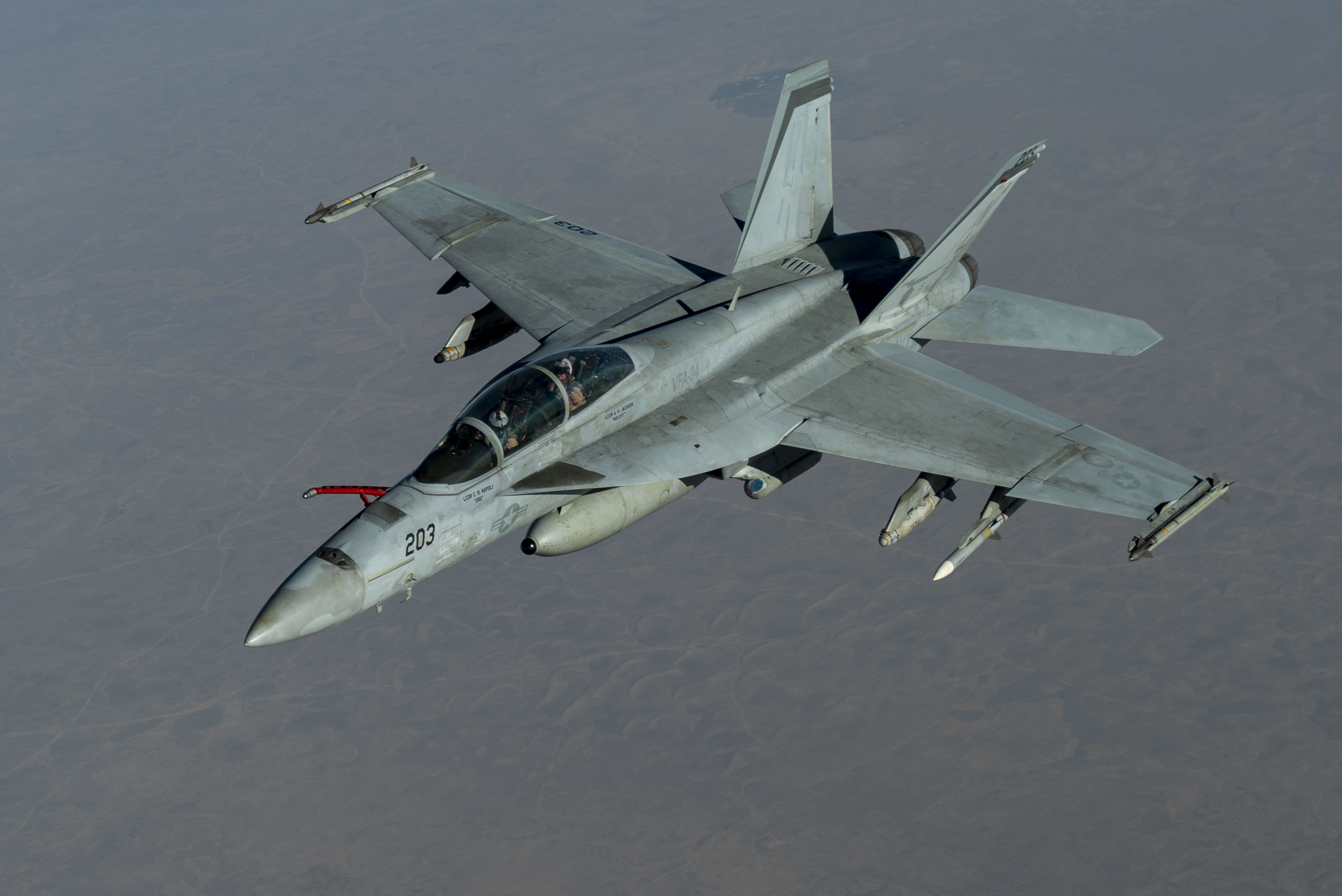 A U.S. Navy F/A-18F Super Hornet, from the "Mighty Shrikes" of Strike Fighter Squadron (VFA) 94, flies over the U.S. Central Command area of responsibility during a mission in support of Operation Inherent Resolve, Sept. 30, 2020. VFA-94 is assigned to Carrier Air Wing 17, deployed aboard the aircraft carrier USS Nimitz (CVN 68), flagship of Nimitz Carrier Strike Group. The F/A-18F is designed to perform fighter escort, fleet air defense, suppression of enemy air defenses, air interdiction, close air support, and aerial reconnaissance. (U.S. Air Force photo by Staff Sgt. James Merriman)