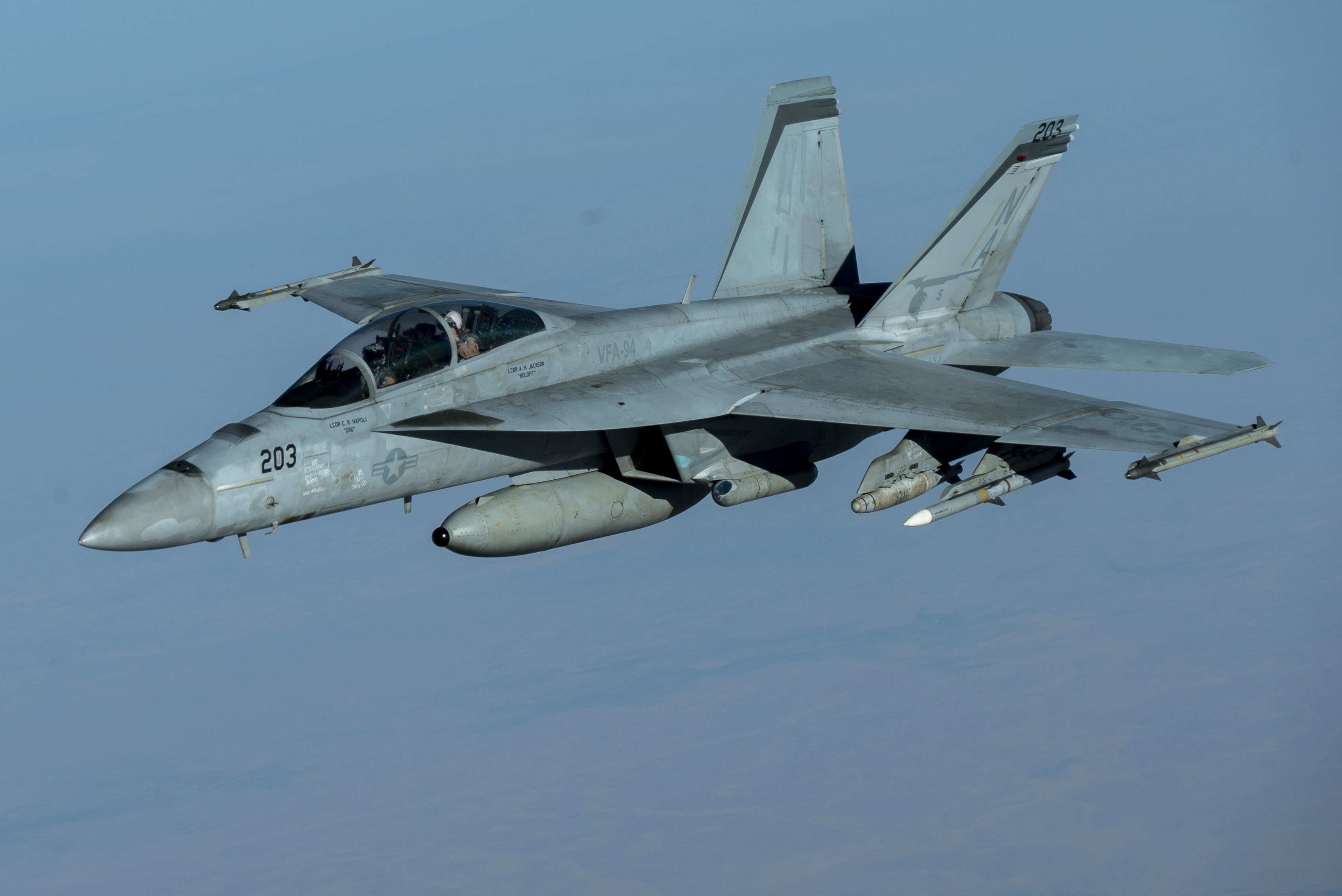 A U.S. Navy F/A-18F Super Hornet, from the "Mighty Shrikes" of Strike Fighter Squadron (VFA) 94, flies over the U.S. Central Command area of responsibility during a mission in support of Operation Inherent Resolve, Sept. 30, 2020. VFA-94 is assigned to Carrier Air Wing 17, deployed aboard the aircraft carrier USS Nimitz (CVN 68), flagship of Nimitz Carrier Strike Group. The F/A-18F is designed to perform fighter escort, fleet air defense, suppression of enemy air defenses, air interdiction, close air support, and aerial reconnaissance. (U.S. Air Force photo by Staff Sgt. James Merriman)