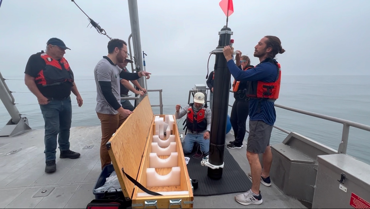 The NPS, Seatrec team performs an early test of the Persistent Smart Acoustic Profiler (PSAP) Voyager off the R/V Fulmar in Monterey Bay. Through a long-standing relationship with the National Marine Sanctuary Program, which operates the National Oceanic and Atmospheric Association (NOAA) vessel, NPS researchers have access to critical oceanographic research capabilities onboard the Fulmar. (Photo courtesy Seatrec)