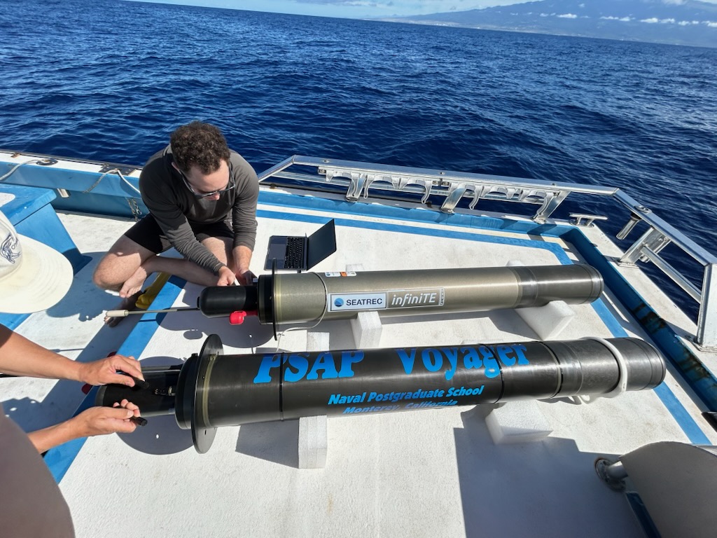 Researchers prepare the Persistent Smart Acoustic Profiler (PSAP) Voyager for initial testing in Monterey Bay, California, in a photo released by the Navy this month. (Seatrec)