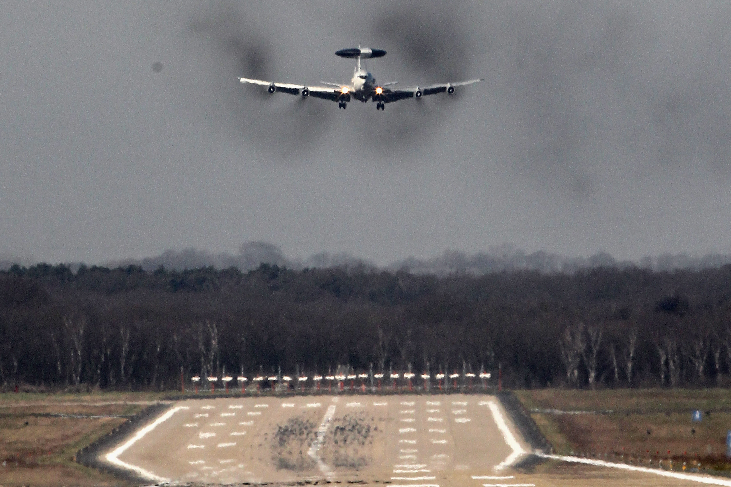 GEILENKIRCHEN, GERMANY - MARCH 14: A NATO E-3A airborne warning and control system (AWACS) aircraft takes off from the NATO air base on March 24, 2011 at Geilenkirchen, Germany. The German government cabinet recently approved sending 300 German air force personnel to fly AWACS based at Geilenkirchen over Afghanistan as a further contribution to the ISAF peacekeeping mission. German Chancellor Angela Merkel has proposed the deployment in order to offset Germany's refusal to contribute to the current American, French and British-led air campaign against Libya, though the measure still requires approval by the Bundestag, which will meet Friday. (Photo by Christof Koepsel/Getty Images)