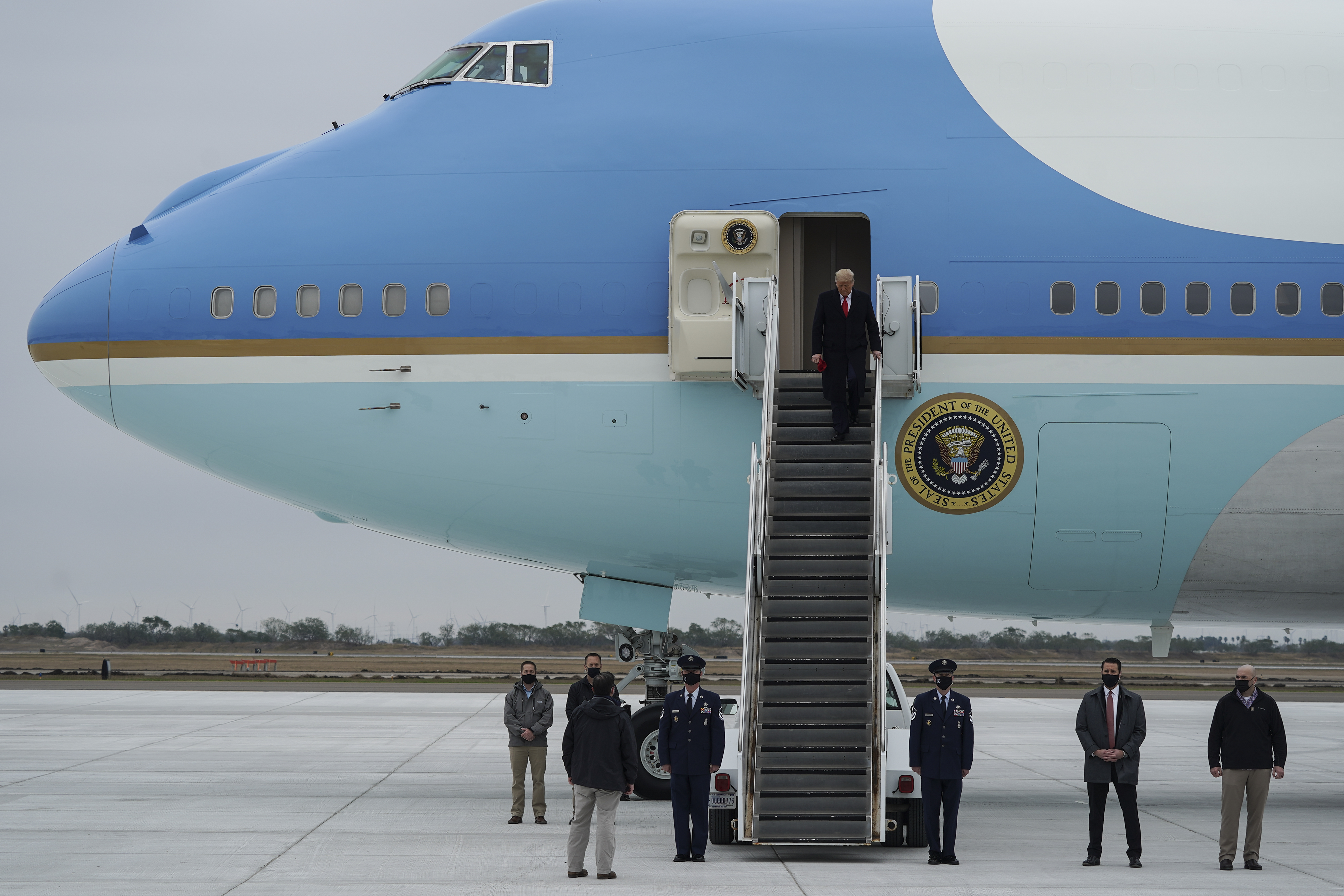  President Donald Trump walks down the stairs as he exits Air Force One at Valley International Airport on January 12, 2021 in Harlingen, Texas. President Trump later delivered remarks during a visit to the U.S.-Mexico Border in Alamo, Texas. (Photo by Go Nakamura/Getty Images)