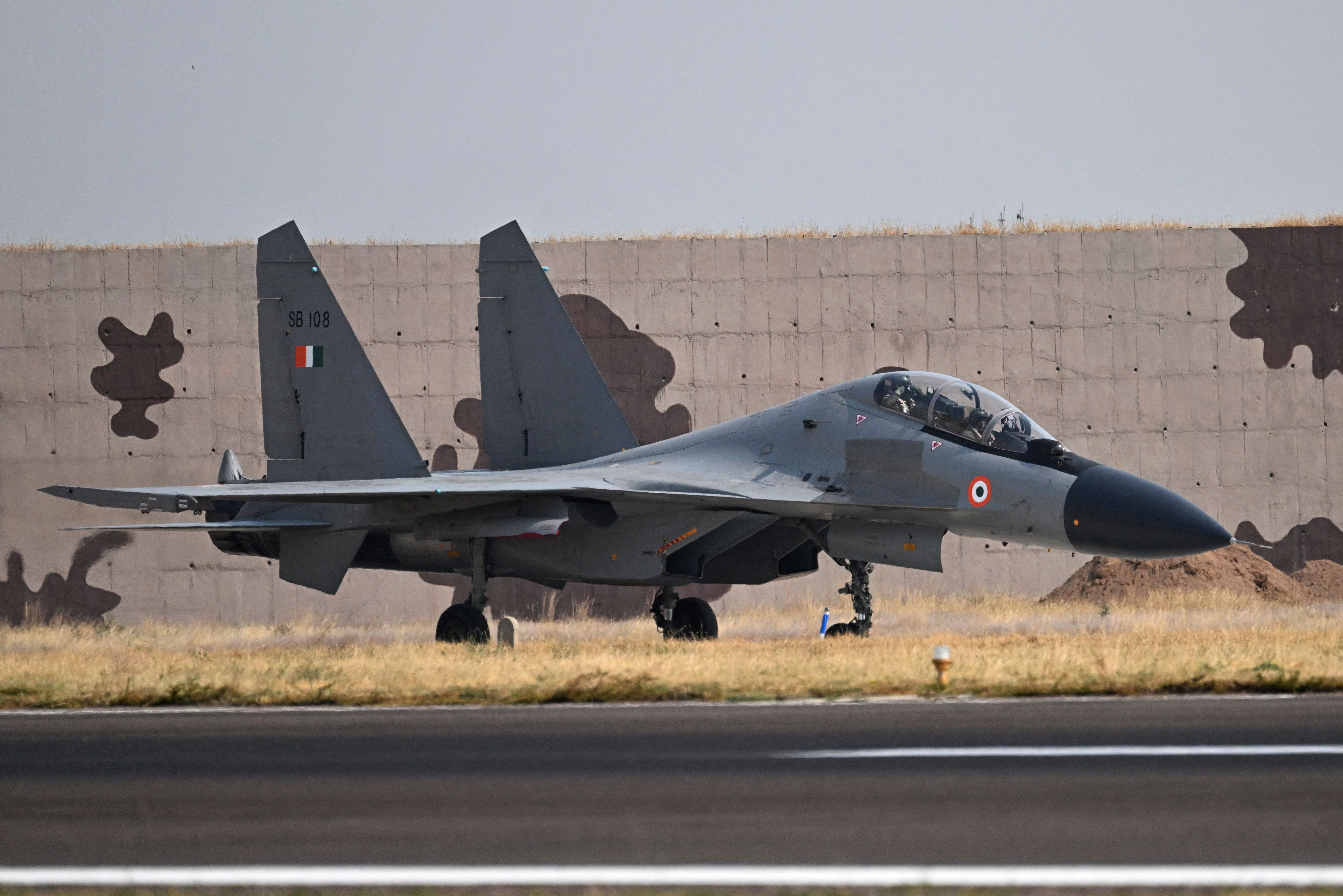 An Indian Air Force (IAF) Sukhoi Su-30MKI fighter jet lands during the joint exercise 'Ex Garuda-VII' between IAF and French Air and Space Force (FASF) at Jodhpur in India's desert state of Rajasthan on November 8, 2022. (Photo by Emmanuel DUNAND / AFP) (Photo by EMMANUEL DUNAND/AFP via Getty Images)