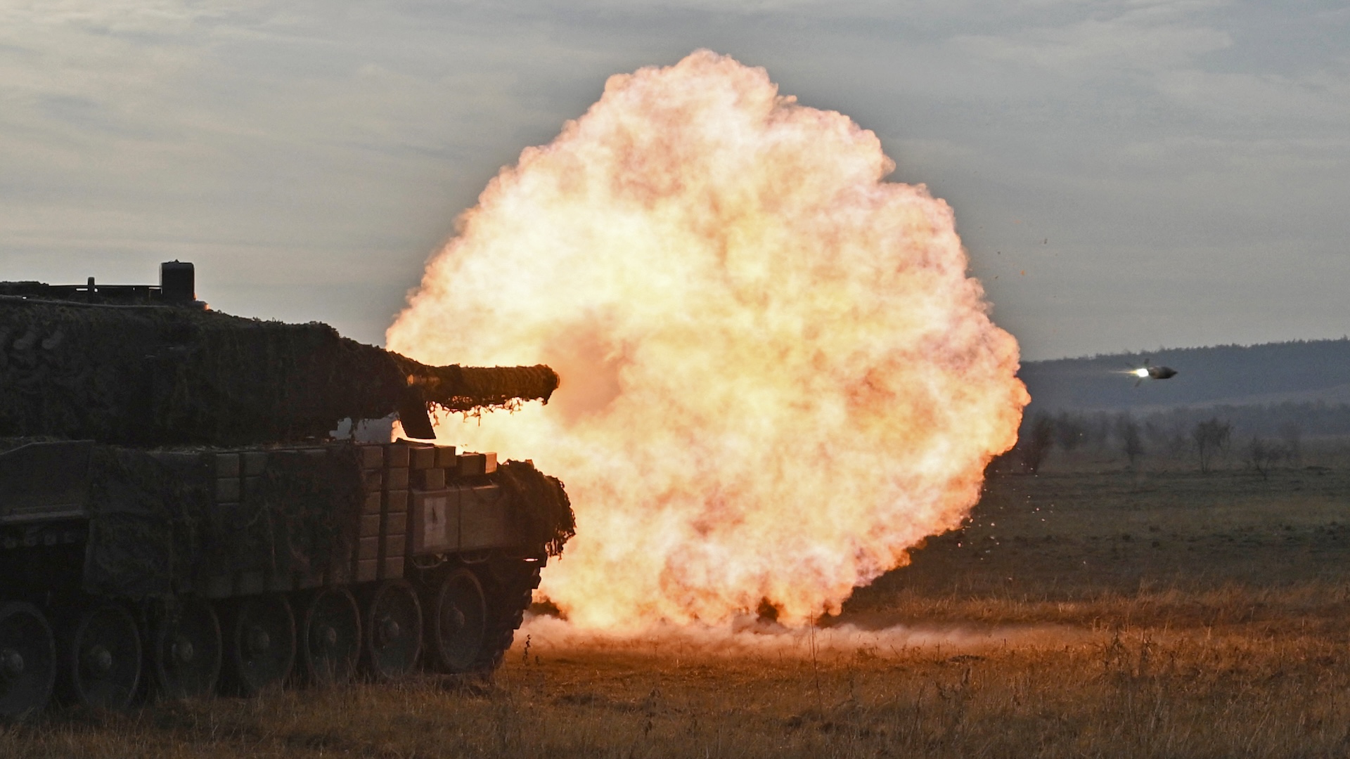 Tankers from the 33rd separate mechanized brigade of the Ukrainian Ground Forces fire with a Leopard 2A4 tank during a field training at an undisclosed location in Ukraine on October 27, 2024, amid the Russian invasion on Ukraine.