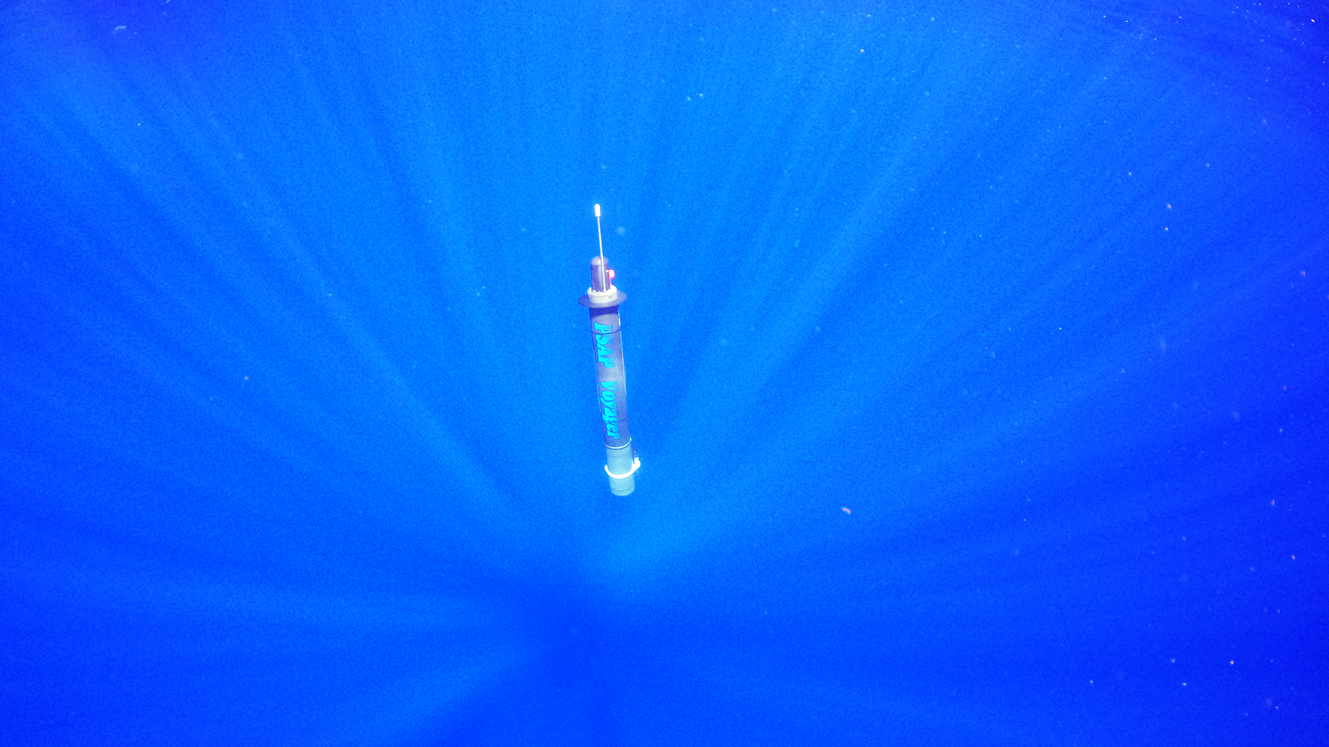 Developed through a collaboration between NPS and Seatrec, the Persistent Smart Acoustic Profiler (PSAP) Voyager is pictured just after it is deployed in the Pacific off the coast of Kona, Hawaii, in November of 2024. The innovative, self-powered autonomous underwater drone represents a major breakthrough in the persistent collection of acoustic data in real-time. (Photo courtesy Tarry Rago)