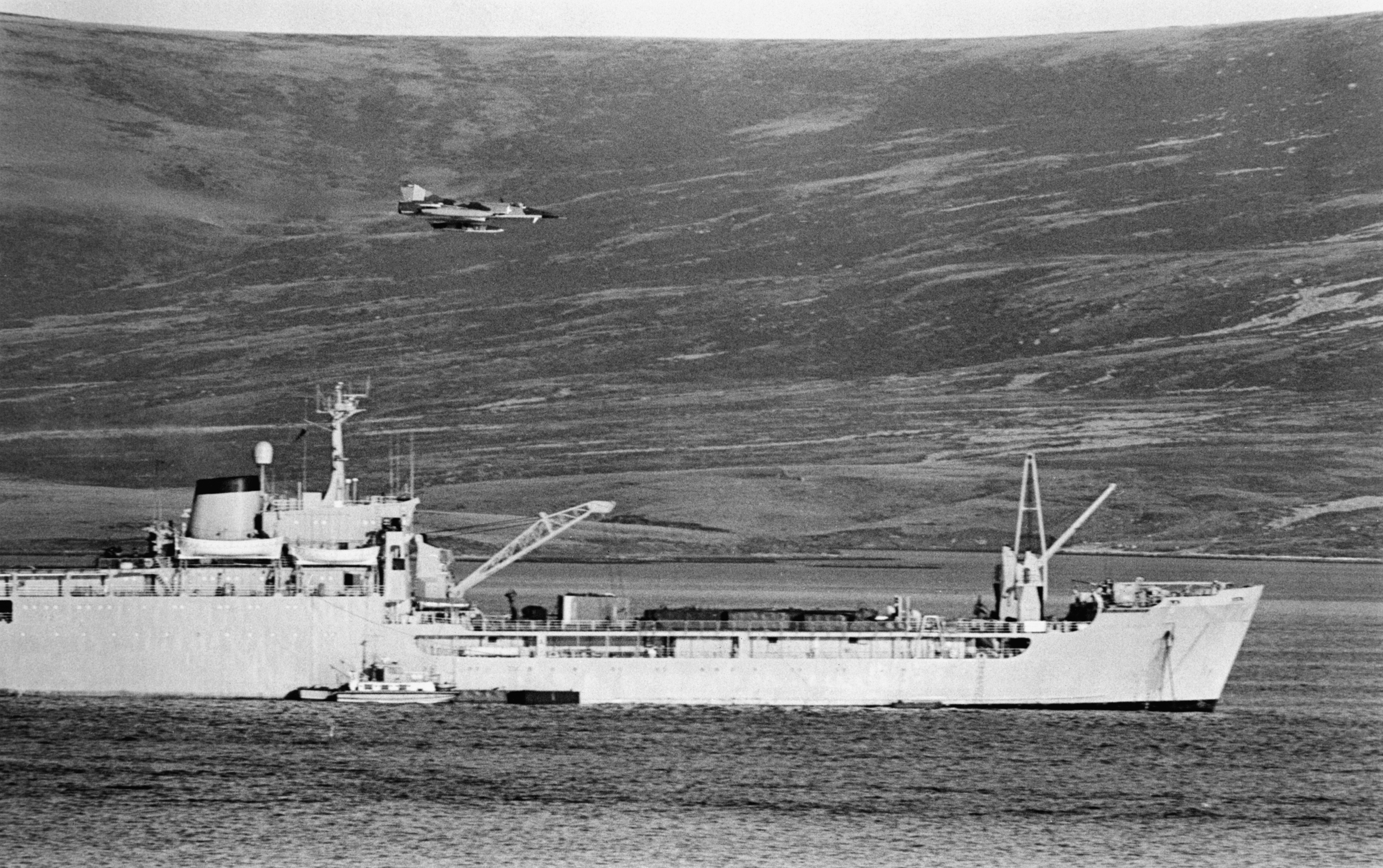 The Falklands Conflict, April - June 1982, An Argentine IAI Dagger passes low over RFA SIR BEDIVERE in San Carlos Water on 24 May 1982. (Photo by Peter Holdgate/ Crown Copyright. Imperial War Museums via Getty Images)