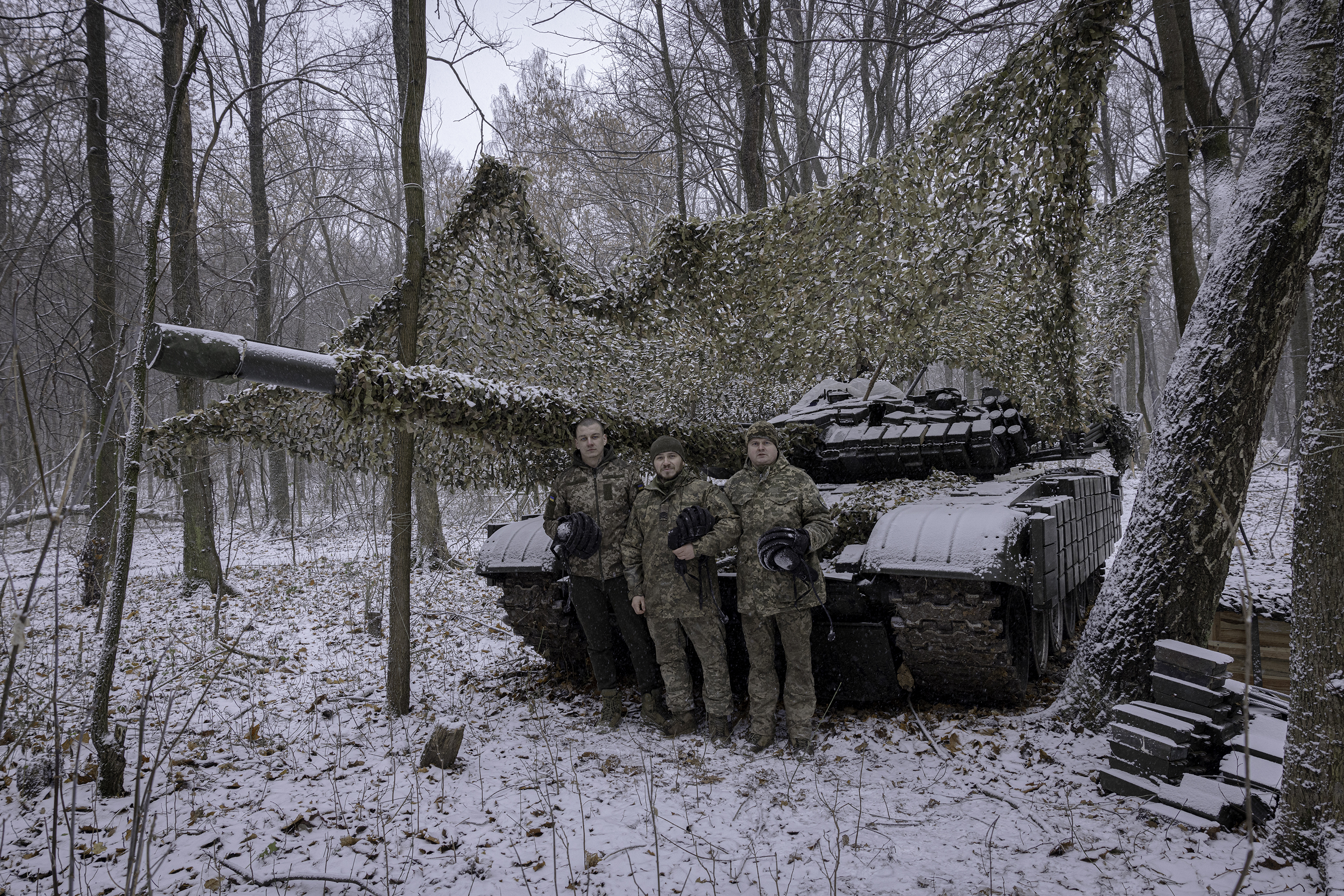  Tank commander Nazar, 23, stands with fellow soldiers Ruslan, 35, and Andrii, 37, at a fallback position in Sumy region, Ukraine. The troops, from Ukraine's 95th Brigade, were preparing for orders to return to Russia's Kursk region. (Photo by Serhiy Morgunov/For The Washington Post via Getty Images)