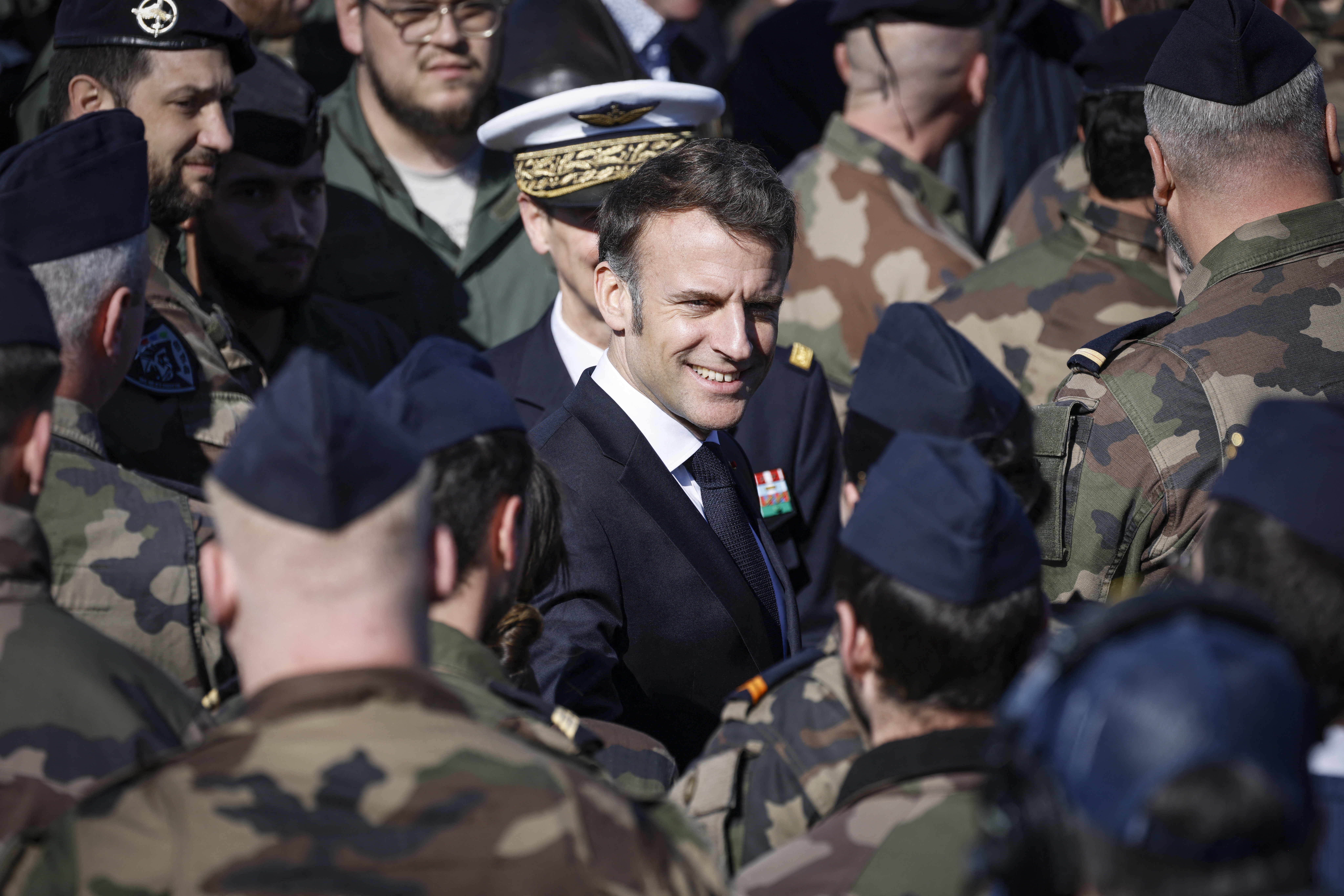 France's President Emmanuel Macron (C) reacts during his visit of the French Air and Space Force (Armee de l'air et de l'espace) Luxeuil-Saint-Sauveur Airbase in Saint-Sauveur, north-eastern France on March 18, 2025. (Photo by Ludovic MARIN / POOL / AFP) (Photo by LUDOVIC MARIN/POOL/AFP via Getty Images)