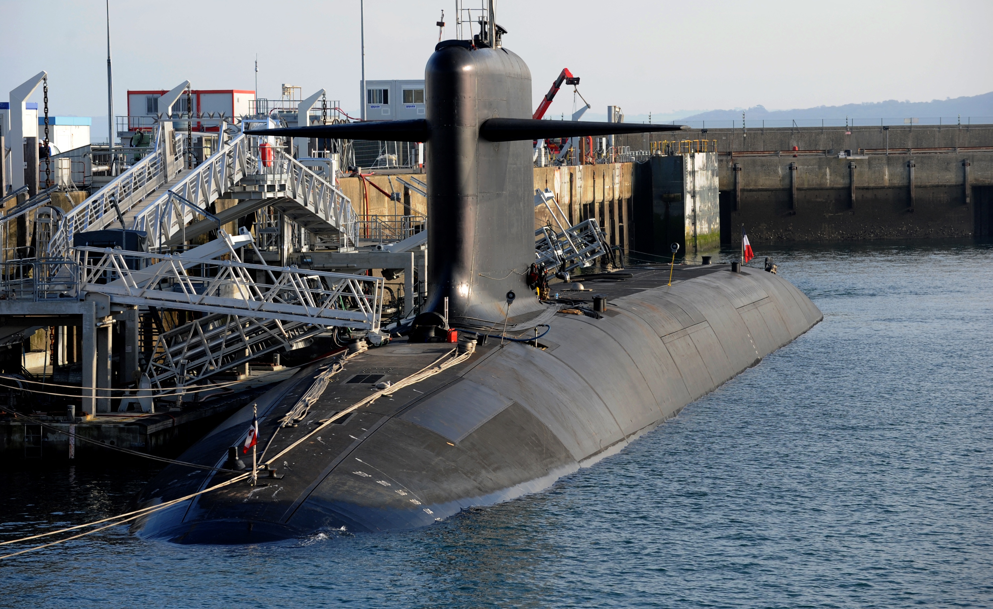 A picture taken on December 5, 2016 shows a nuclear submarine at the naval base in Ile Longue, western of France. The submarines stay invisible for 70 days in the depth of the ocean. Their mission is to deliver a nuclear weapon when the French President give the order. Four nuclear-powered ballistic-missile submarines insure the French nuclear dissuasion. (Photo by FRED TANNEAU / AFP) (Photo by FRED TANNEAU/AFP via Getty Images)