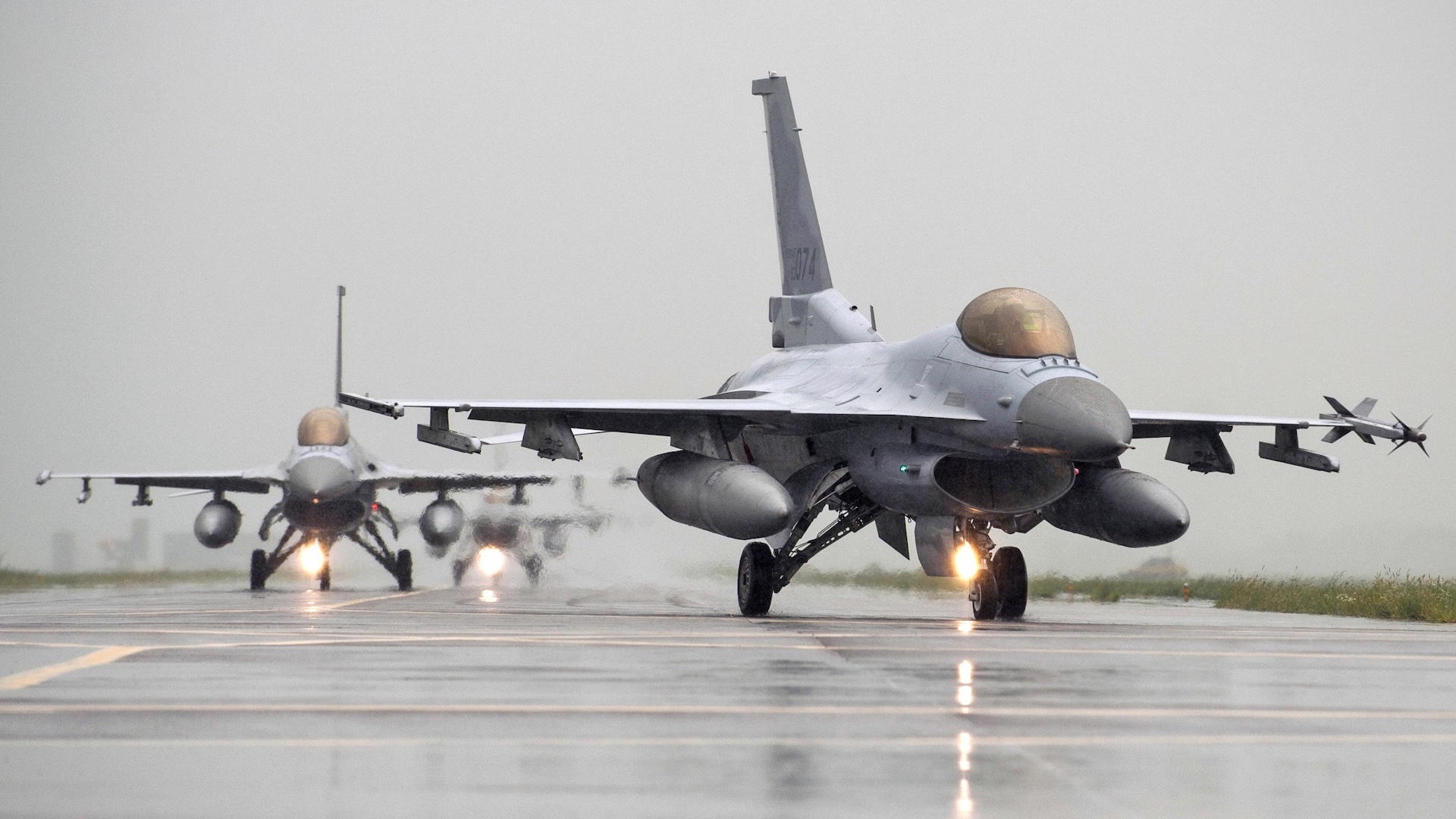 F-16 Fighting Falcons from Kunsan Air Base and South Korean KF-16s taxi to the runway together during Exercise Buddy Wing 14-8 at Seosan Air Base, Republic of Korea Aug. 21, 2014. The purpose of the exercise was not only to improve interoperability between U.S. Air Force and ROKAF fighter squadrons, but to practice with ROKAF KF-16 units for their first upcoming RED FLAG exercise in Alaska.