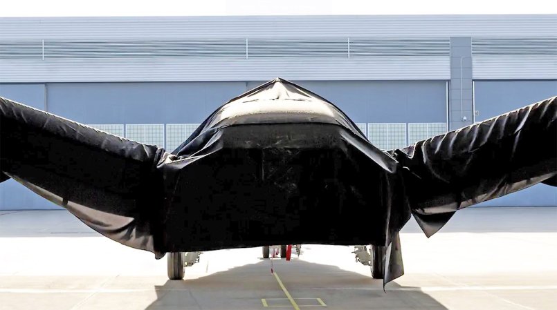 Boeing Defense Teases Mystery Aircraft Unveiling By Hiding It Under A Black Sheet